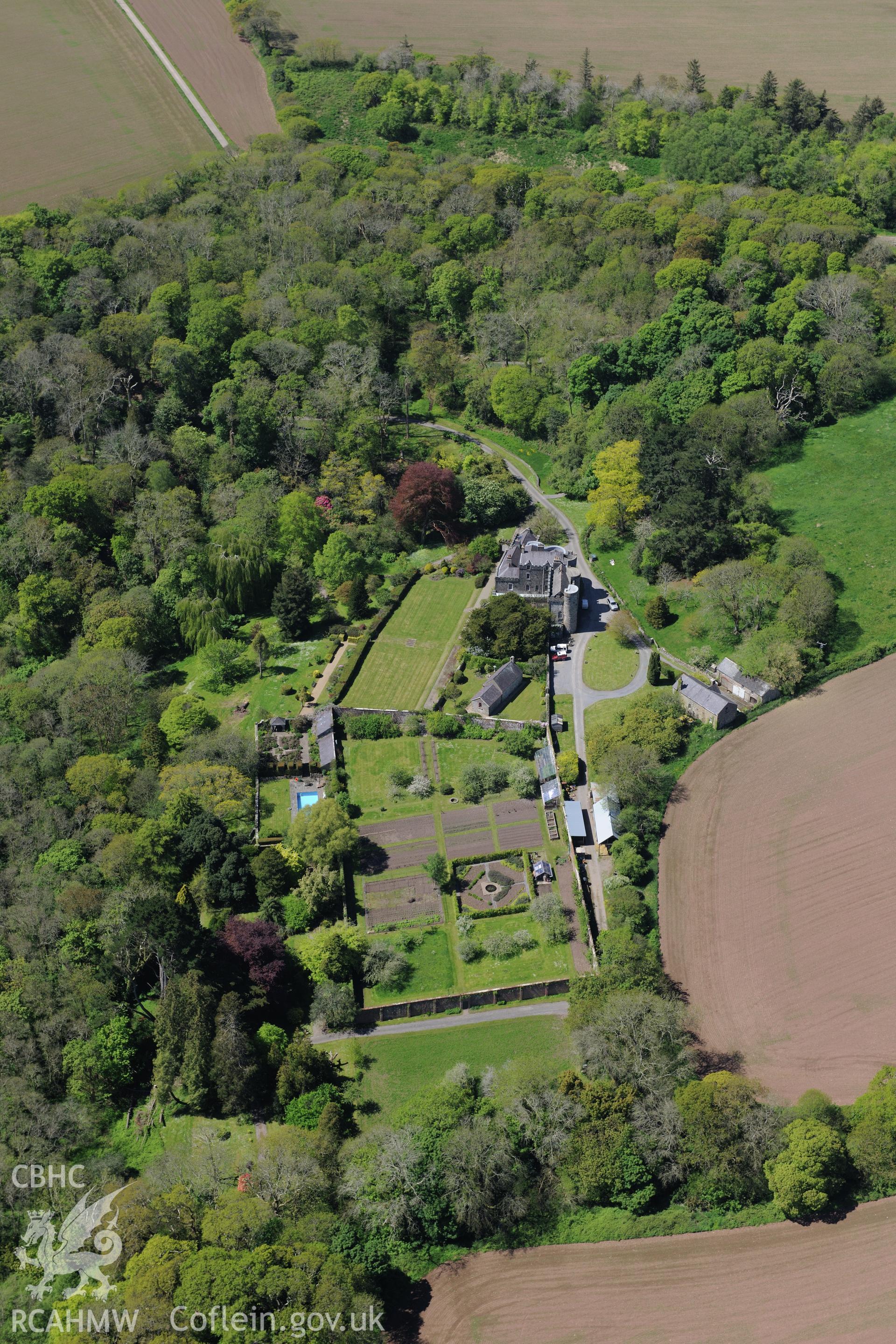 Upton Castle and Gardens, and Upton Chapel, near Cosheston, Pembroke Dock. Oblique aerial photograph taken during the Royal Commission's programme of archaeological aerial reconnaissance by Toby Driver on 13th May 2015.