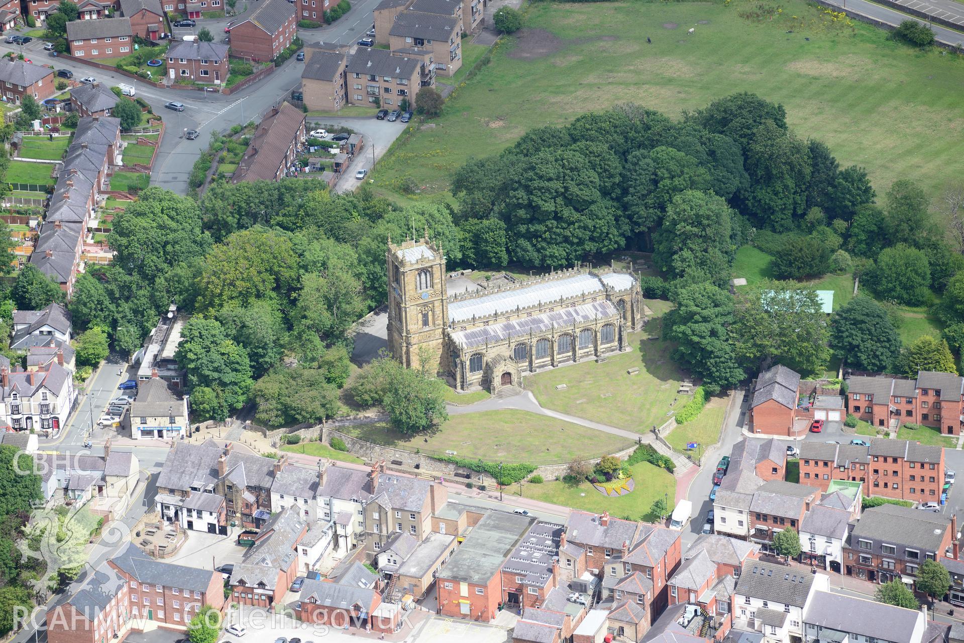 St. Mary's Church and the Dolphin Hotel, Mold. Oblique aerial photograph taken during the Royal Commission's programme of archaeological aerial reconnaissance by Toby Driver on 30th July 2015.