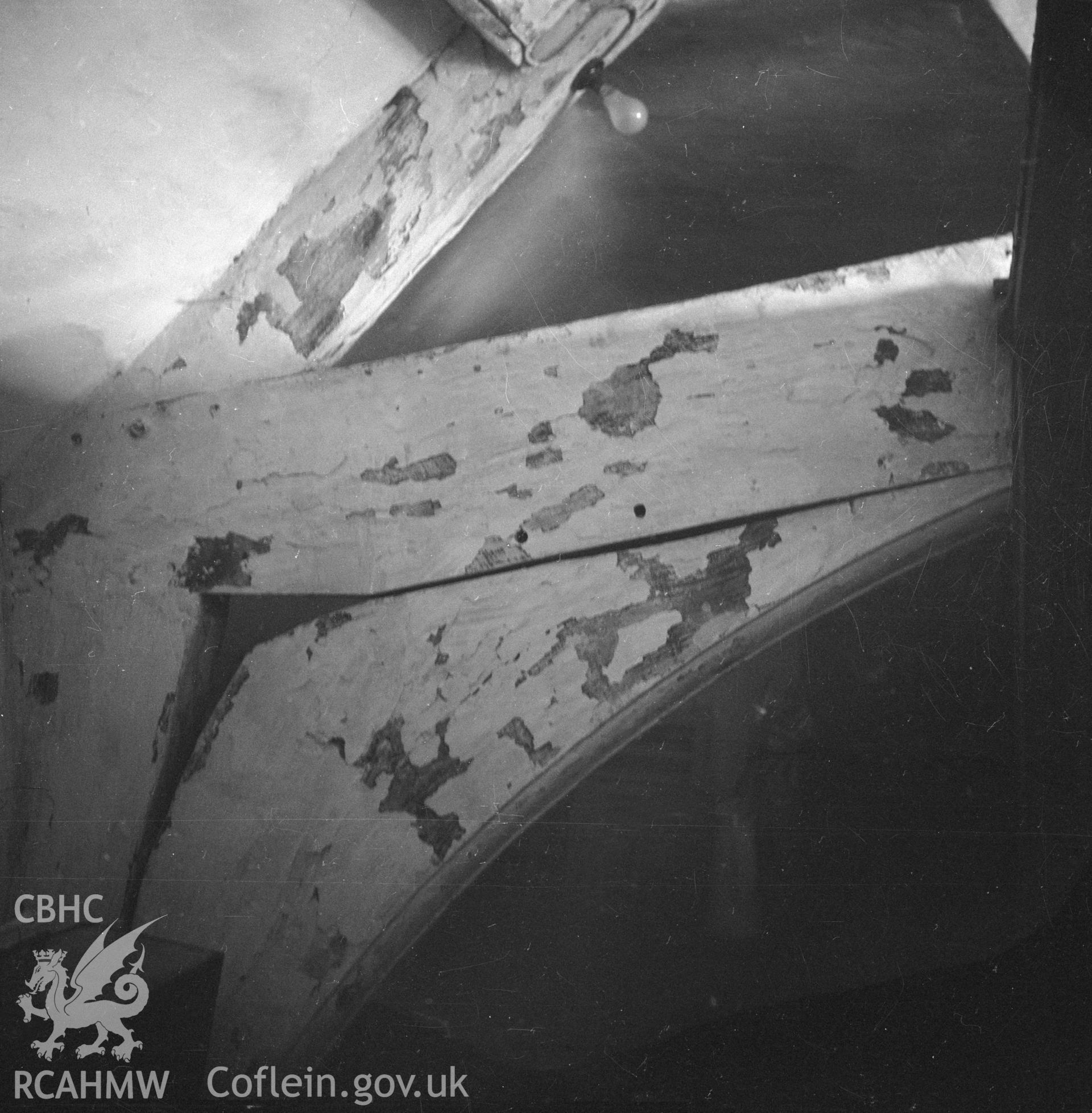 Digital copy of a nitrate negative showing cruck beam at Lower Berse near Wrexham, Denbighshire.
