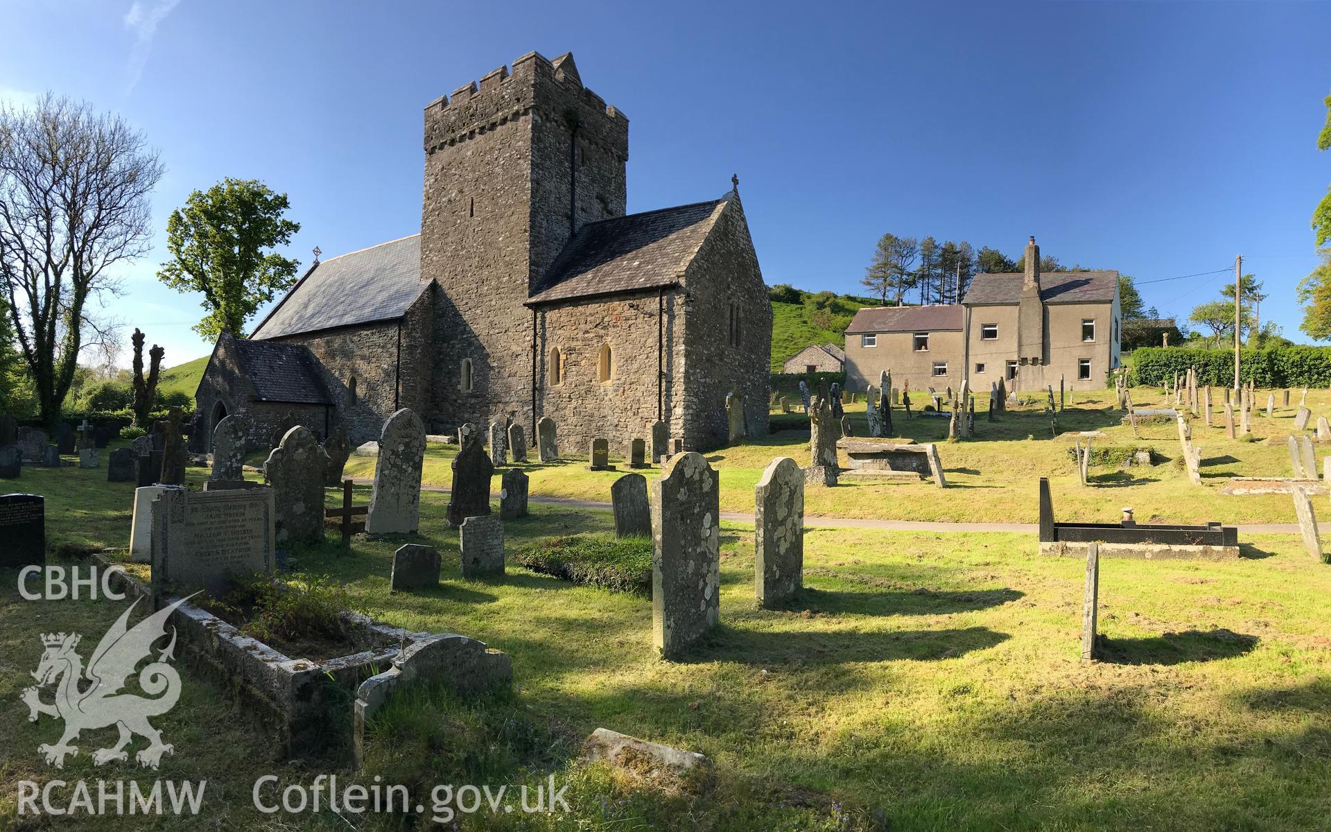 Colour photo showing the exterior of St. Cadog's Church and associated graveyard in Cheriton, taken by Paul R. Davis, 19th May 2018.