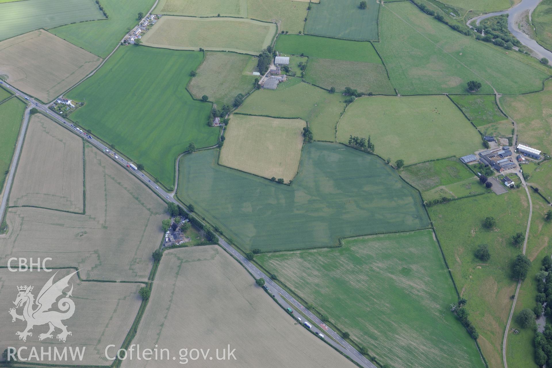 Cropmark complex on lower rectory road, east of Berriew, between Welshpool and Newtown. Oblique aerial photograph taken during the Royal Commission's programme of archaeological aerial reconnaissance by Toby Driver on 30th June 2015.