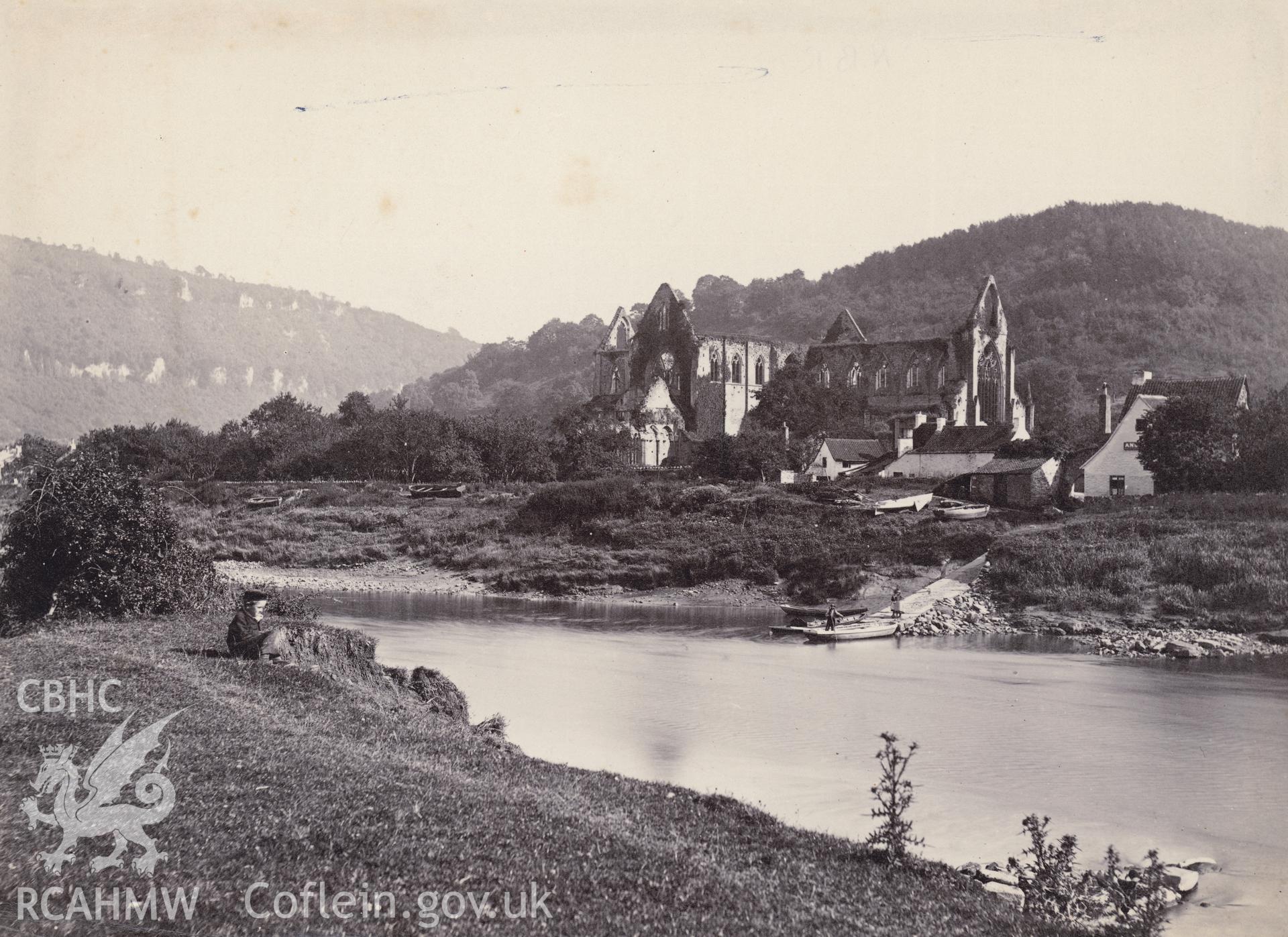 Digital copy of a circa 1870 albumen print showing a view of Tintern Abbey from across the river.