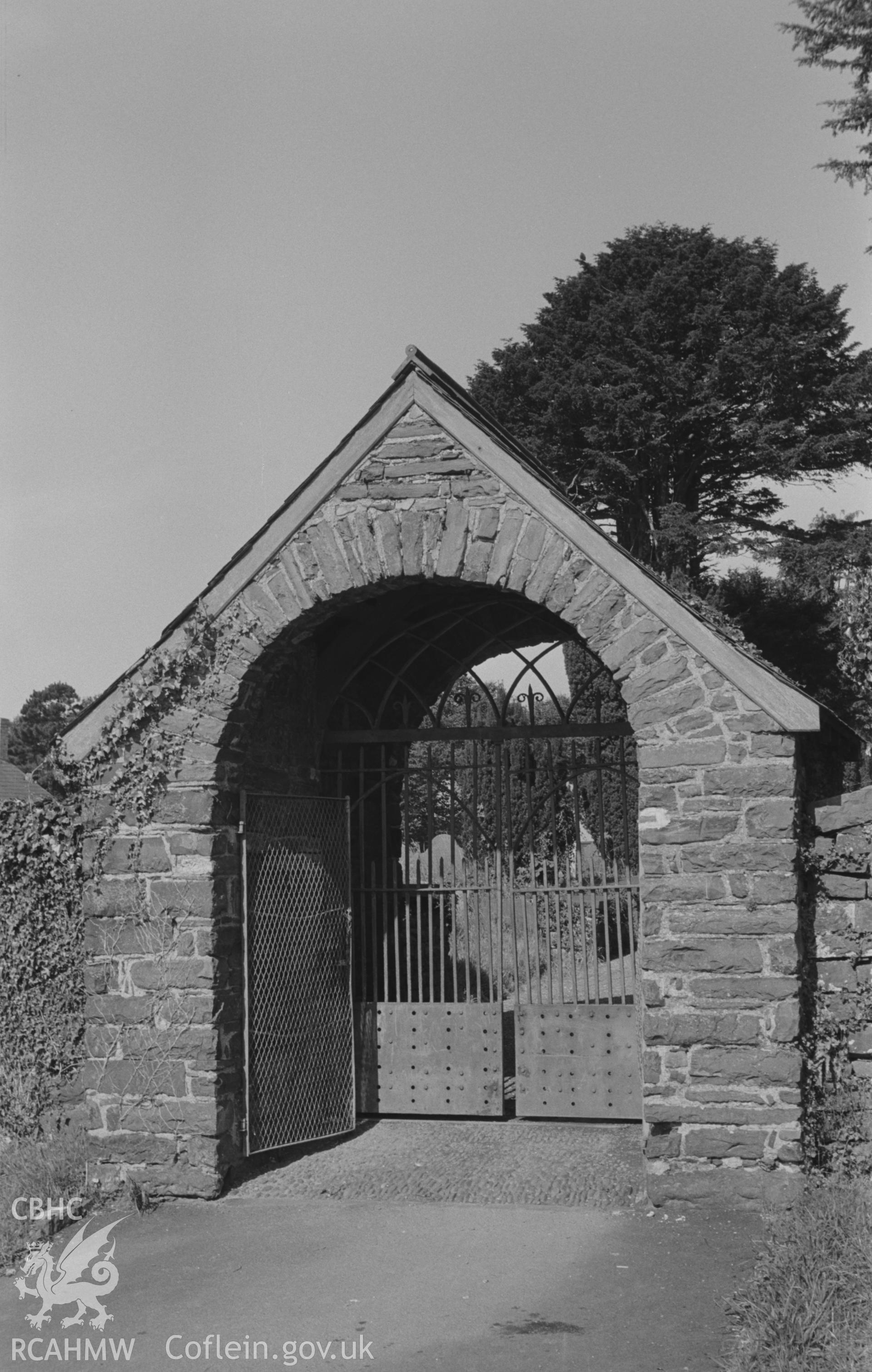 Digital copy of a black and white negative showing east lychgate in St. Padarn's churchyard, Llanbadarn, Aberystwyth (c.1800; ironwork is 1814). [View looking west from Grid Reference SN 590 809]. Photographed by Arthur O. Chater in August 1967.