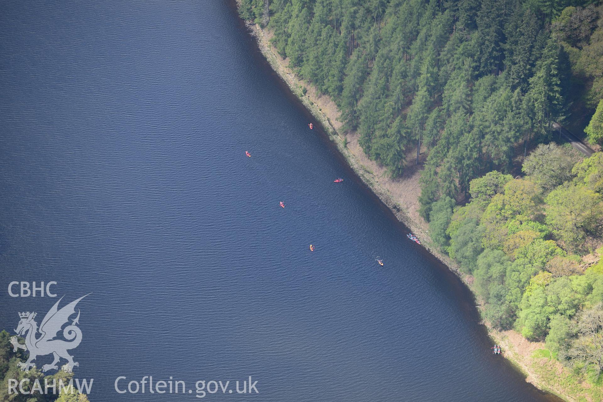 Kayakers at Caban Coch Reservoir, Elan Valley Water Scheme. Oblique aerial photograph taken during the Royal Commission's programme of archaeological aerial reconnaissance by Toby Driver on 3rd June 2015.