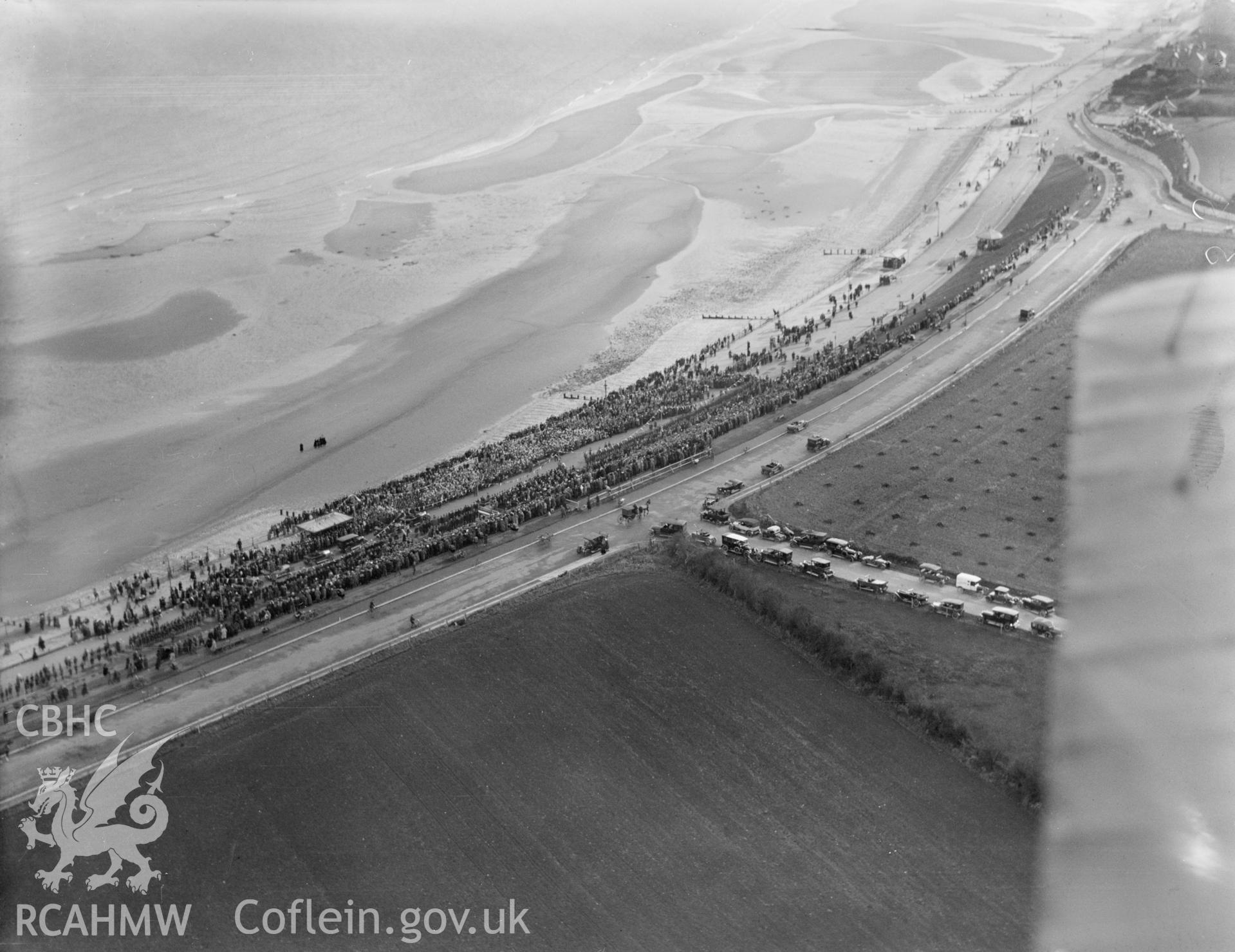 Colwyn Bay showing distant view of ceremony and crowds during during the visit of the Prince of Wales (later Edward VIII) in November 1923, oblique aerial view. 5?x4? black and white glass plate negative.