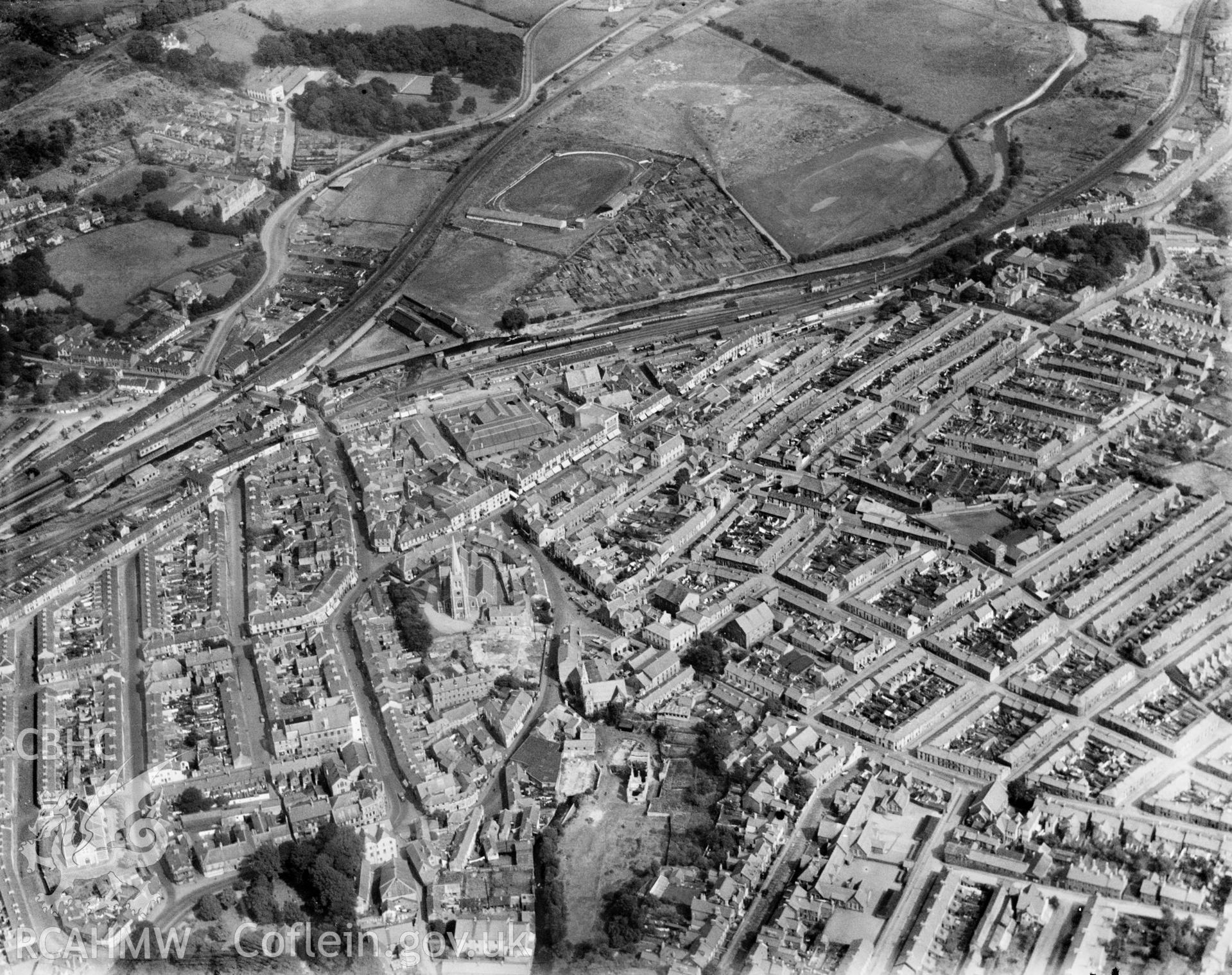 View of Aberdare showing distant view of Ynys Stadium, oblique aerial view. 5?x4? black and white glass plate negative.