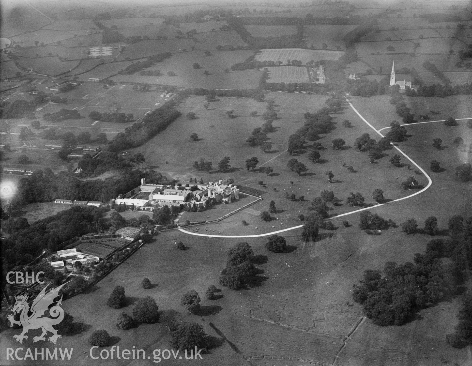 Bodelwyddan Castle showing First World War practice trenches and bomb craters in the foreground, oblique aerial view. 5?x4? black and white glass plate negative.
