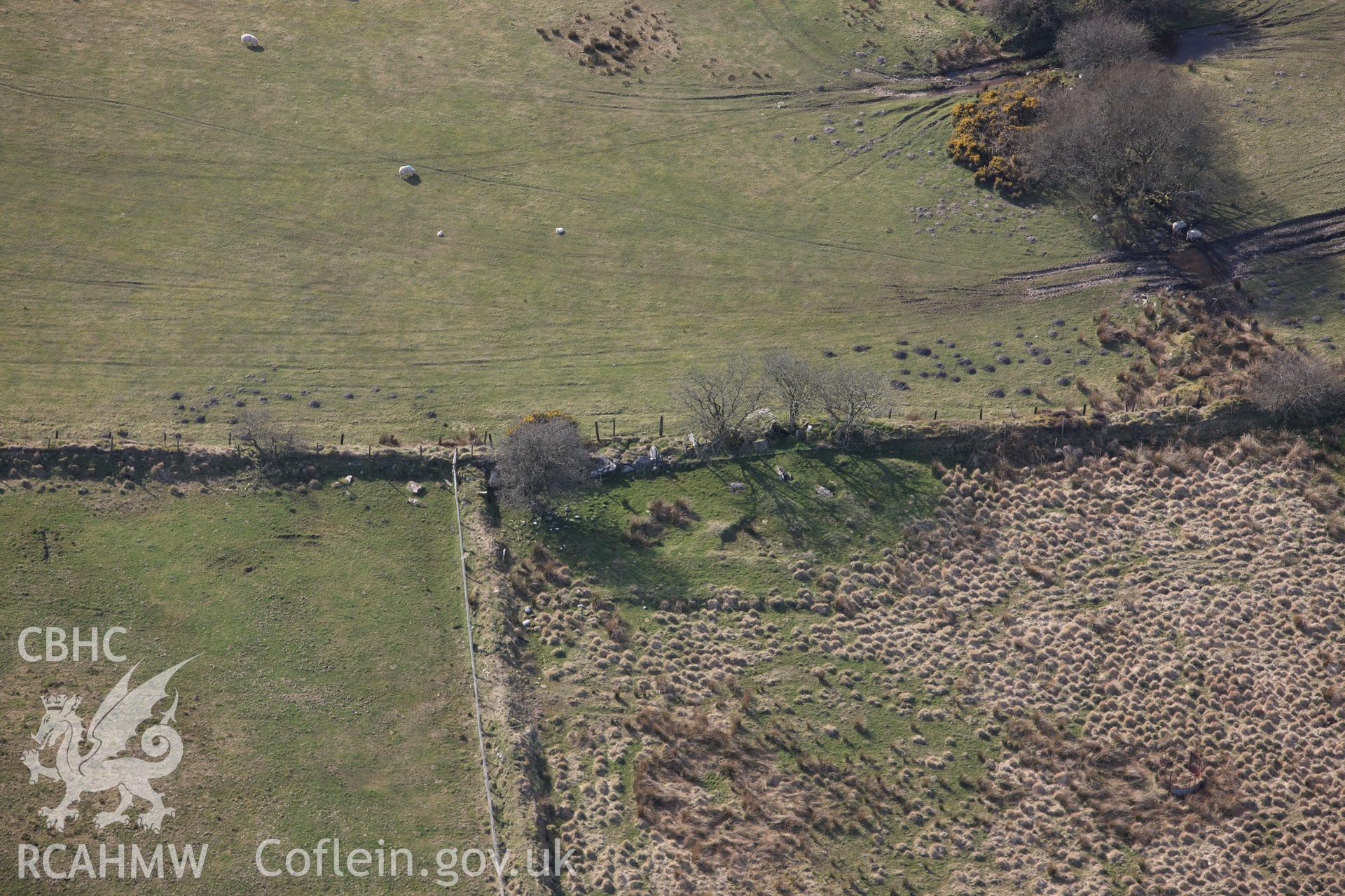 RCAHMW colour oblique aerial photograph of Cerrig Llwydion Chambered Tomb. Taken on 13 April 2010 by Toby Driver