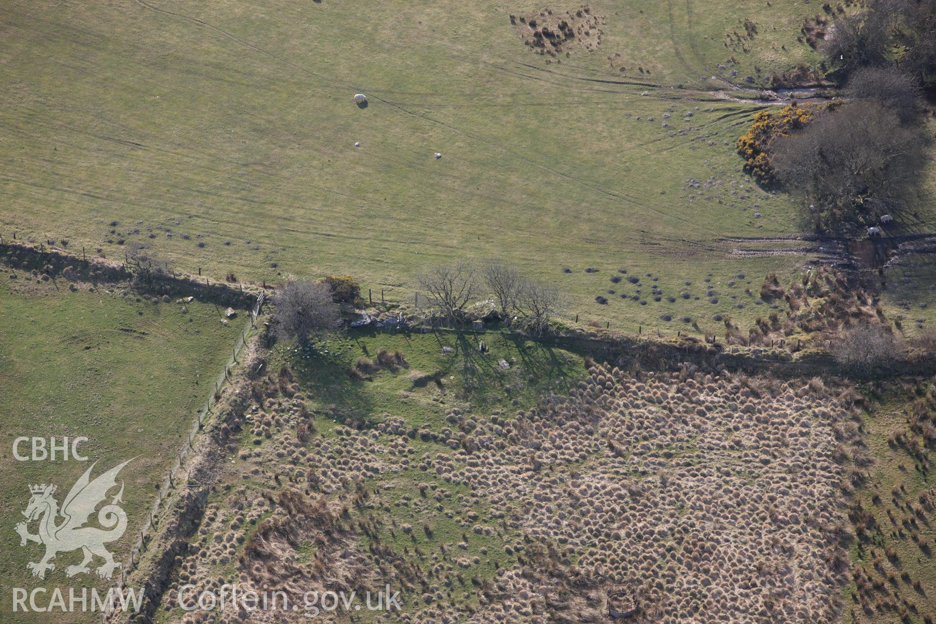 RCAHMW colour oblique aerial photograph of Cerrig Llwydion Chambered Tomb. Taken on 13 April 2010 by Toby Driver