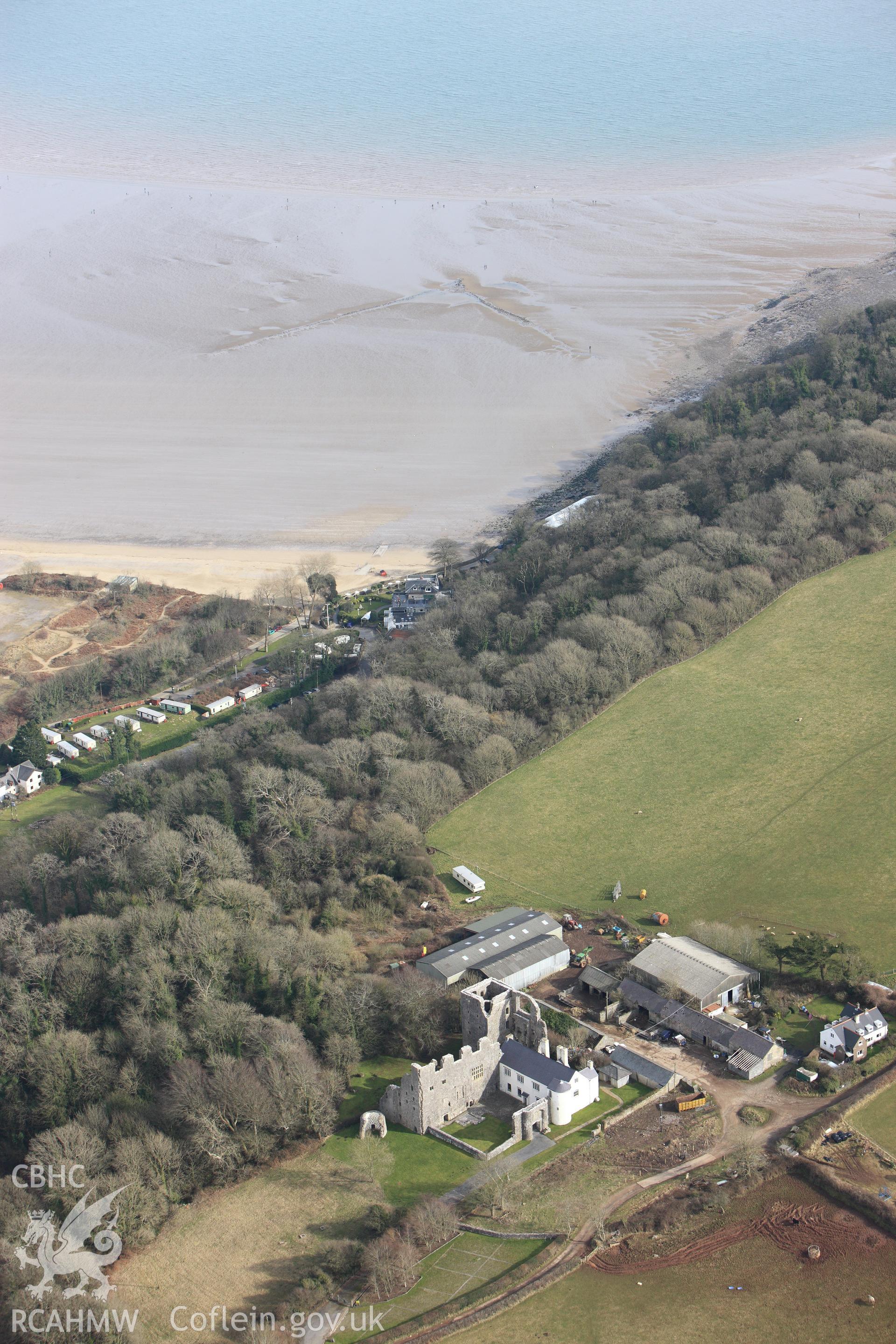RCAHMW colour oblique photograph of Oxwich Castle, and Oxwich Bay, fish trap. Taken by Toby Driver on 02/03/2010.