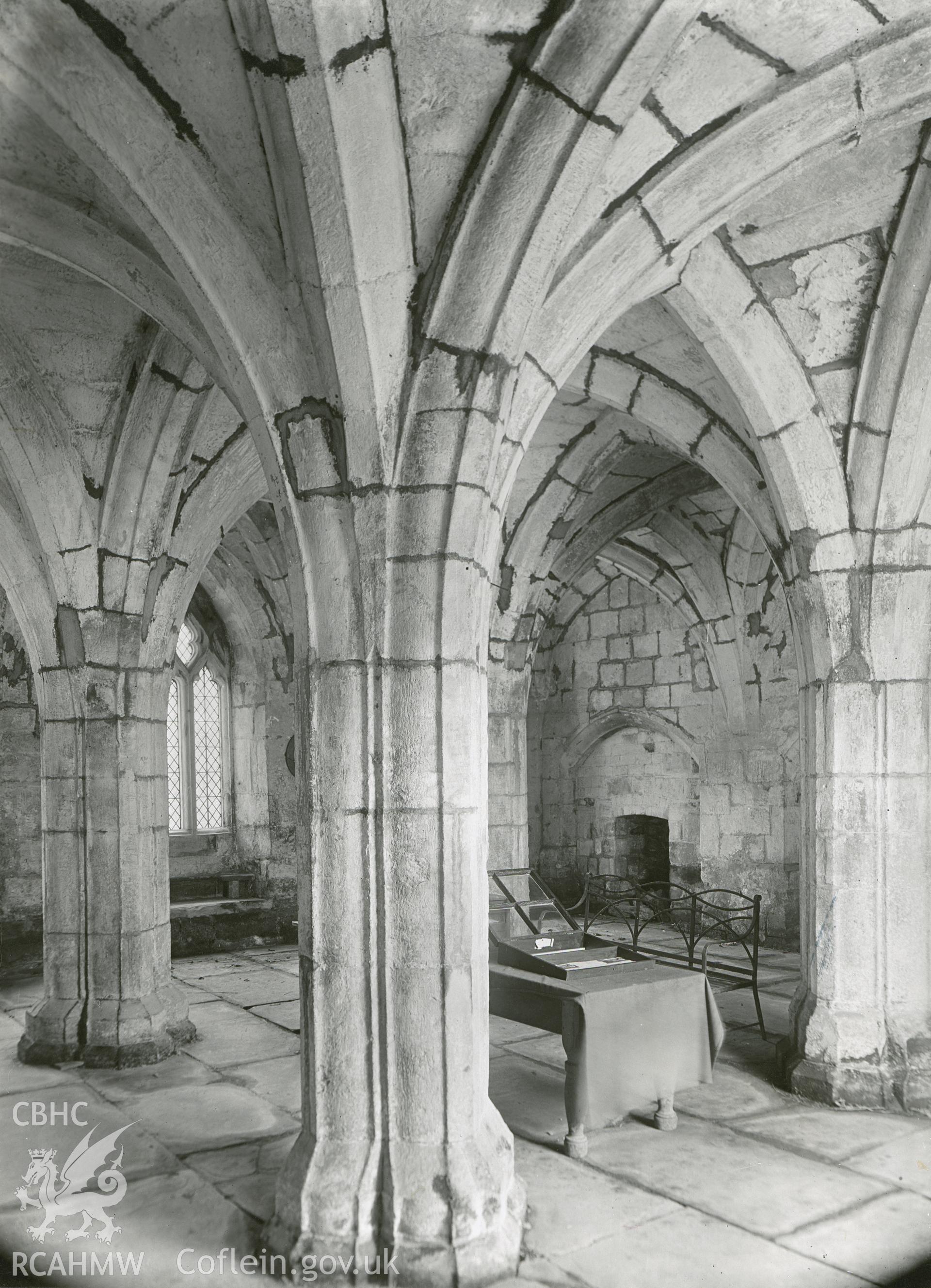 Digitised copy of a black and white print showing an interior view of the chapter house at Valle Crucis Abbey taken by F.H. Crossley, 1947. Negative held by NMR England.