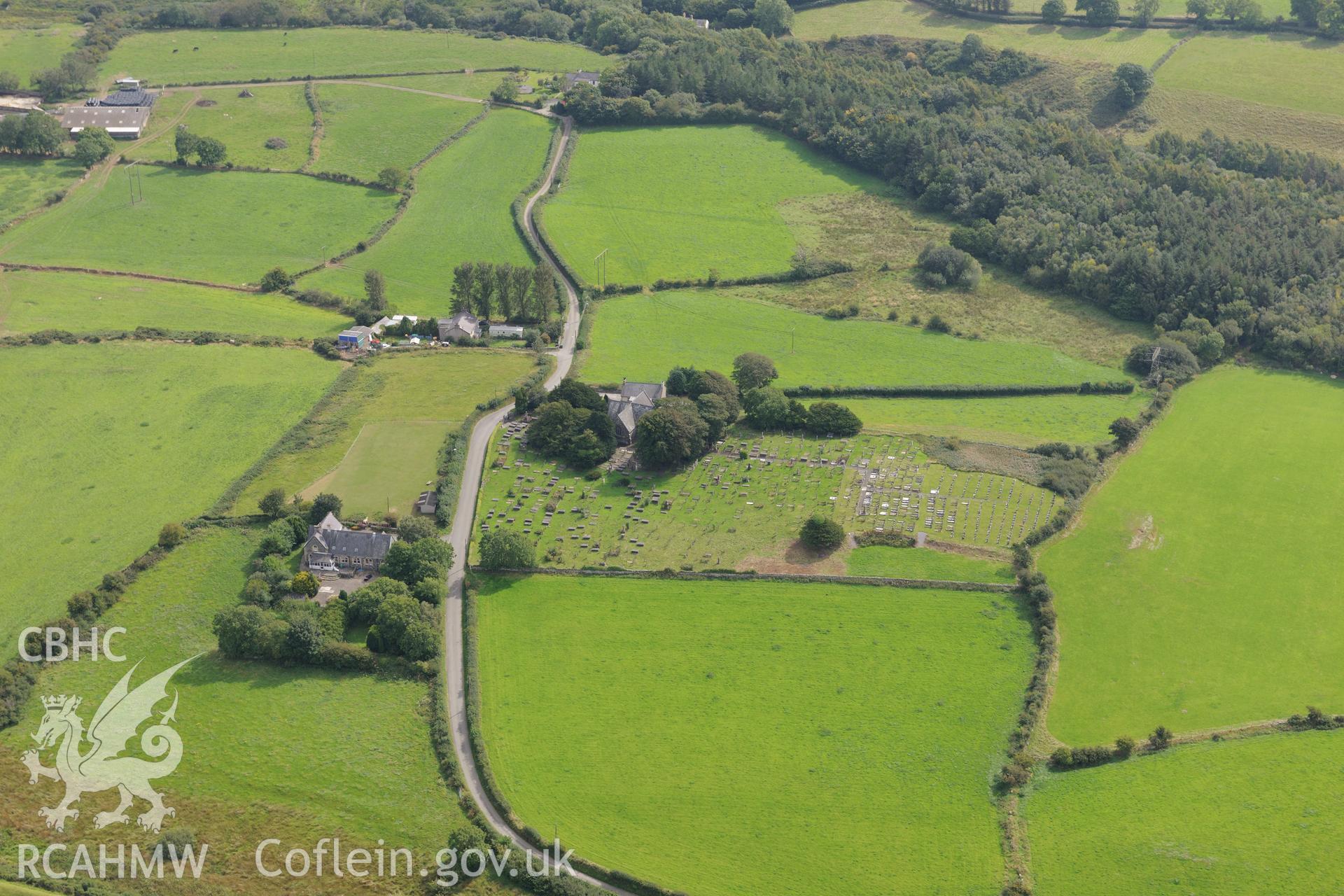 St. Deiniolen's church and Tyn-Llan-Uchaf enclosure, Llanddeiniolen. Oblique aerial photograph taken during the Royal Commission's programme of archaeological aerial reconnaissance by Toby Driver on 11th September 2015.