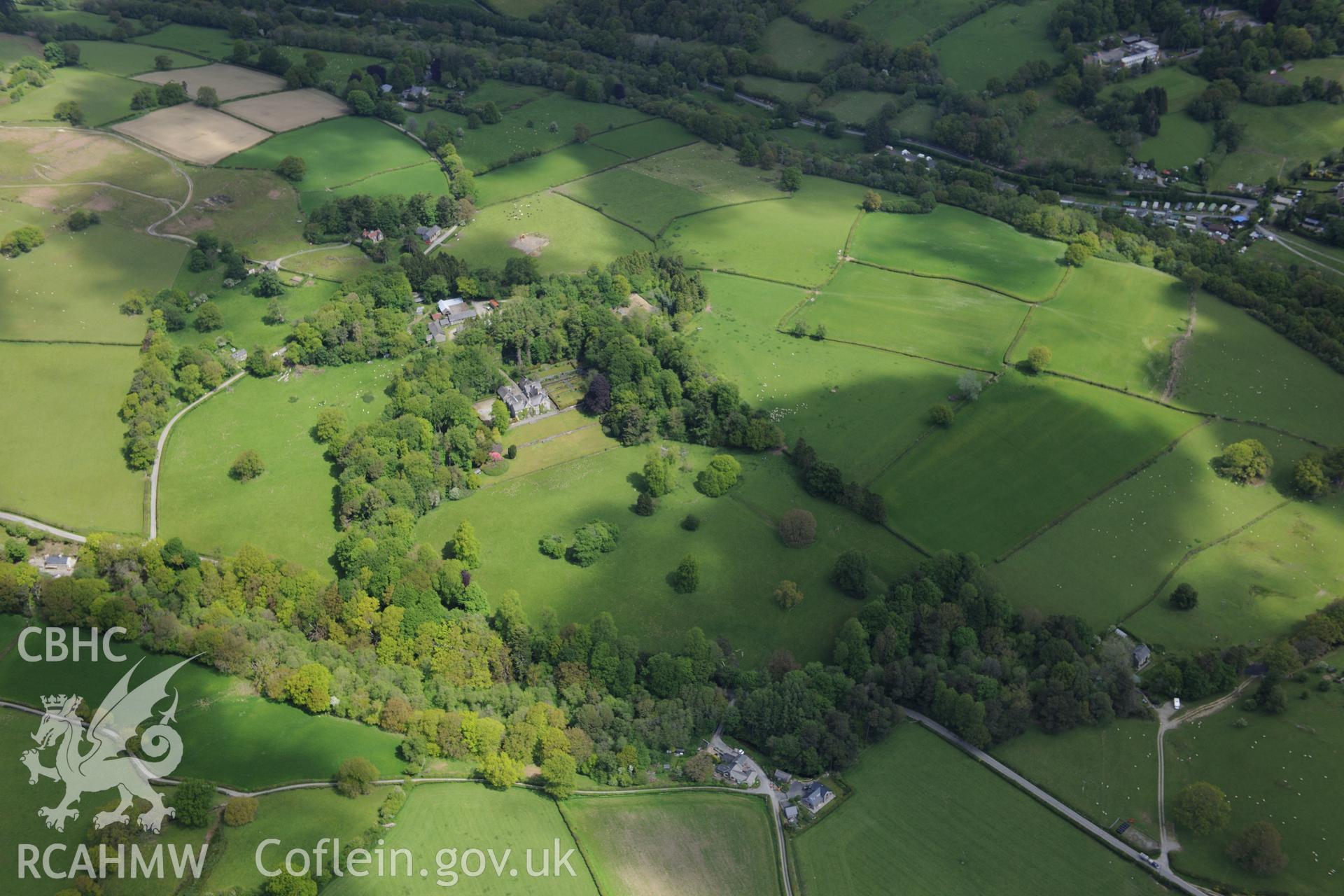 Derw country house and garden and Derw home farm including cowhouse, barn, sawmill, stable and cartshed. Oblique aerial photograph taken during the Royal Commission's programme of archaeological aerial reconnaissance by Toby Driver on 3rd June 2015.
