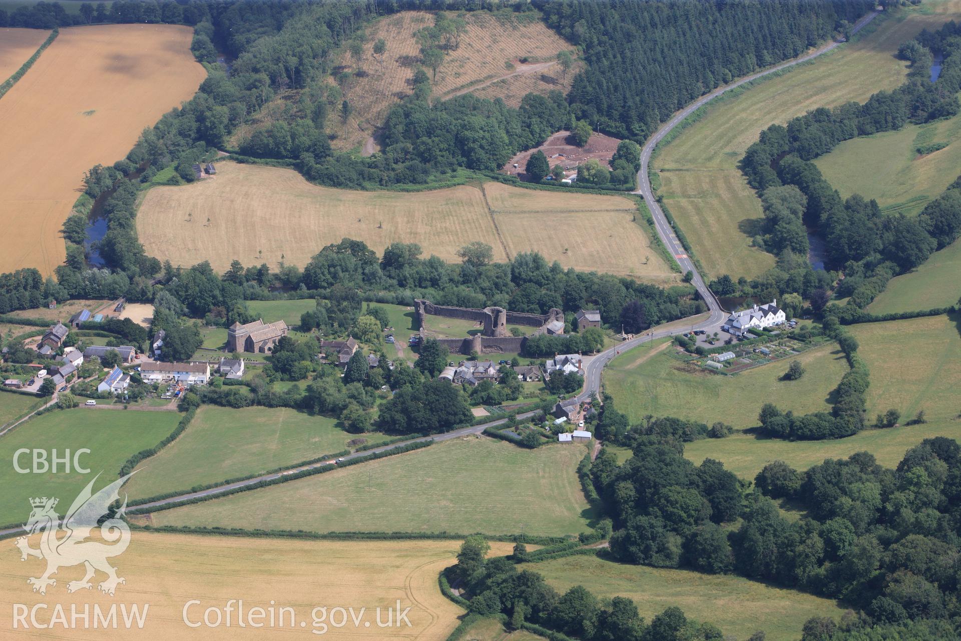 Skenfrith Castle, St. Bridget's Church, and the Bell Inn, Skenfrith, north west of Monmouth. Oblique aerial photograph taken during the Royal Commission?s programme of archaeological aerial reconnaissance by Toby Driver on the 1st August 2013.