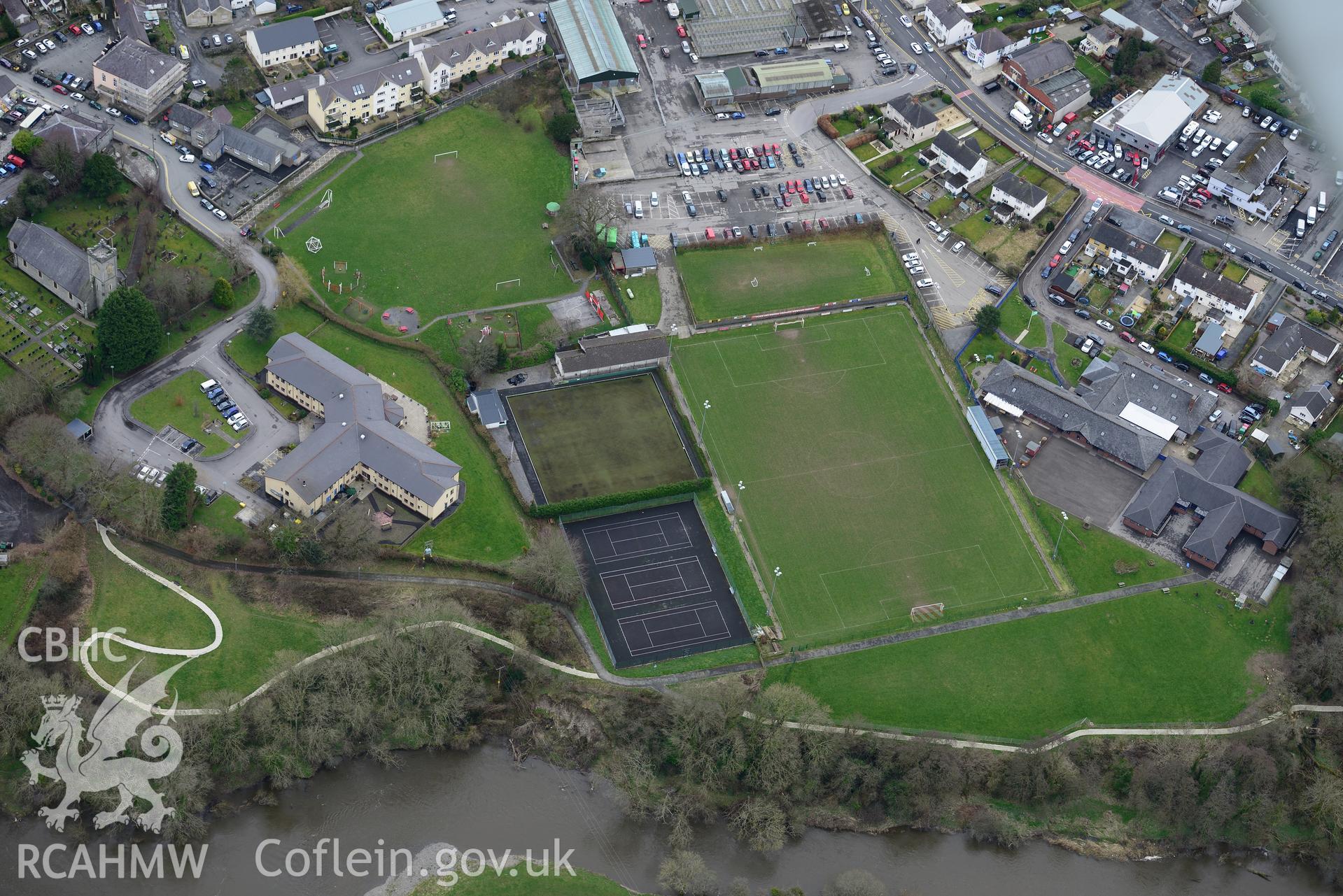 Ysgol y Ddwylan primary school and Maes Llywelyn assisted living residence, Newcastle Emlyn. Oblique aerial photograph taken during the Royal Commission's programme of archaeological aerial reconnaissance by Toby Driver on 13th March 2015.