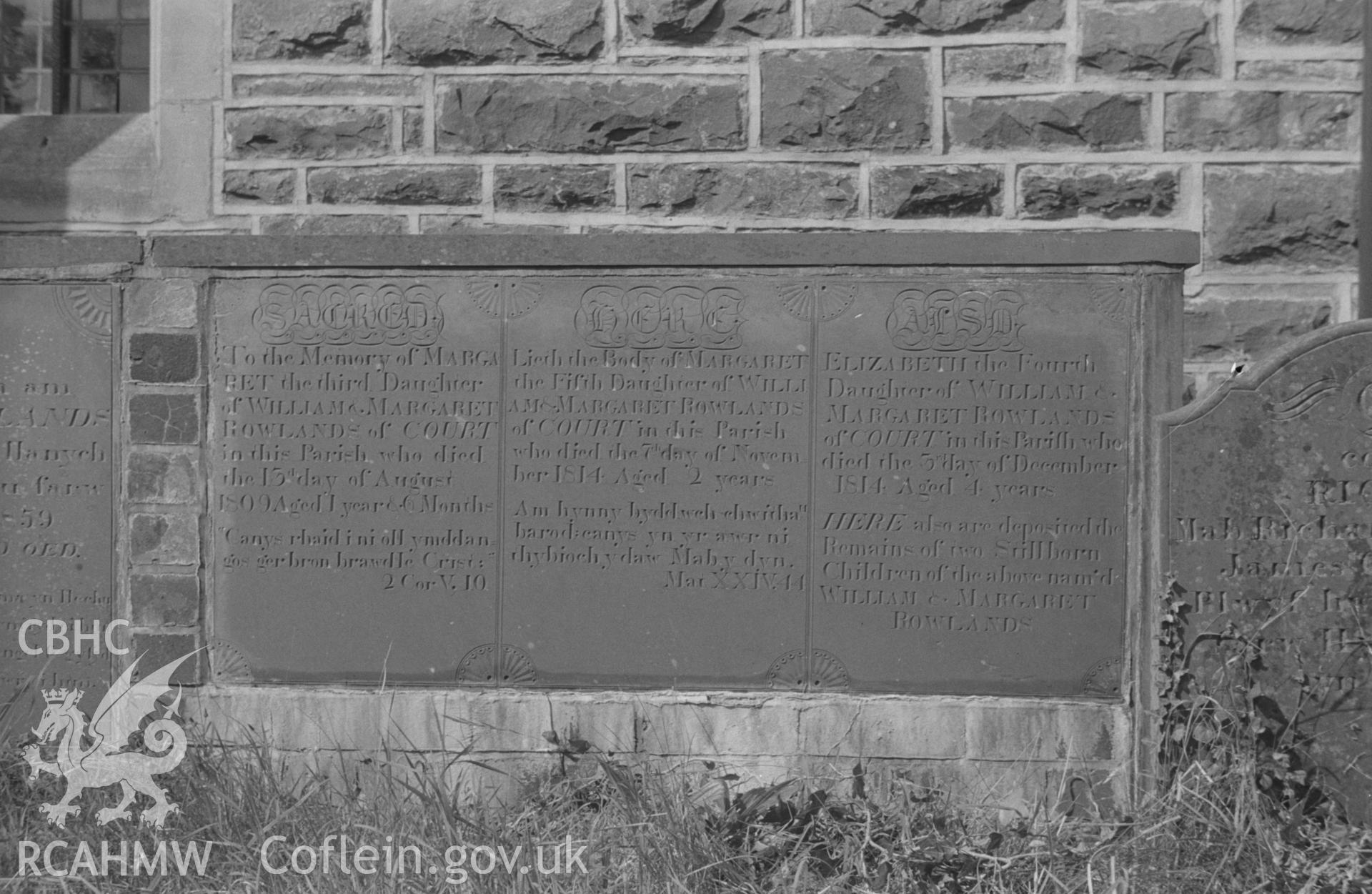 Digital copy of a black and white negative showing view of gravestone in memory of Margaret and William Roland's children who died in infancy, at St. Non's Church, Llanerchaeron. Photographed by Arthur O. Chater in September 1966.