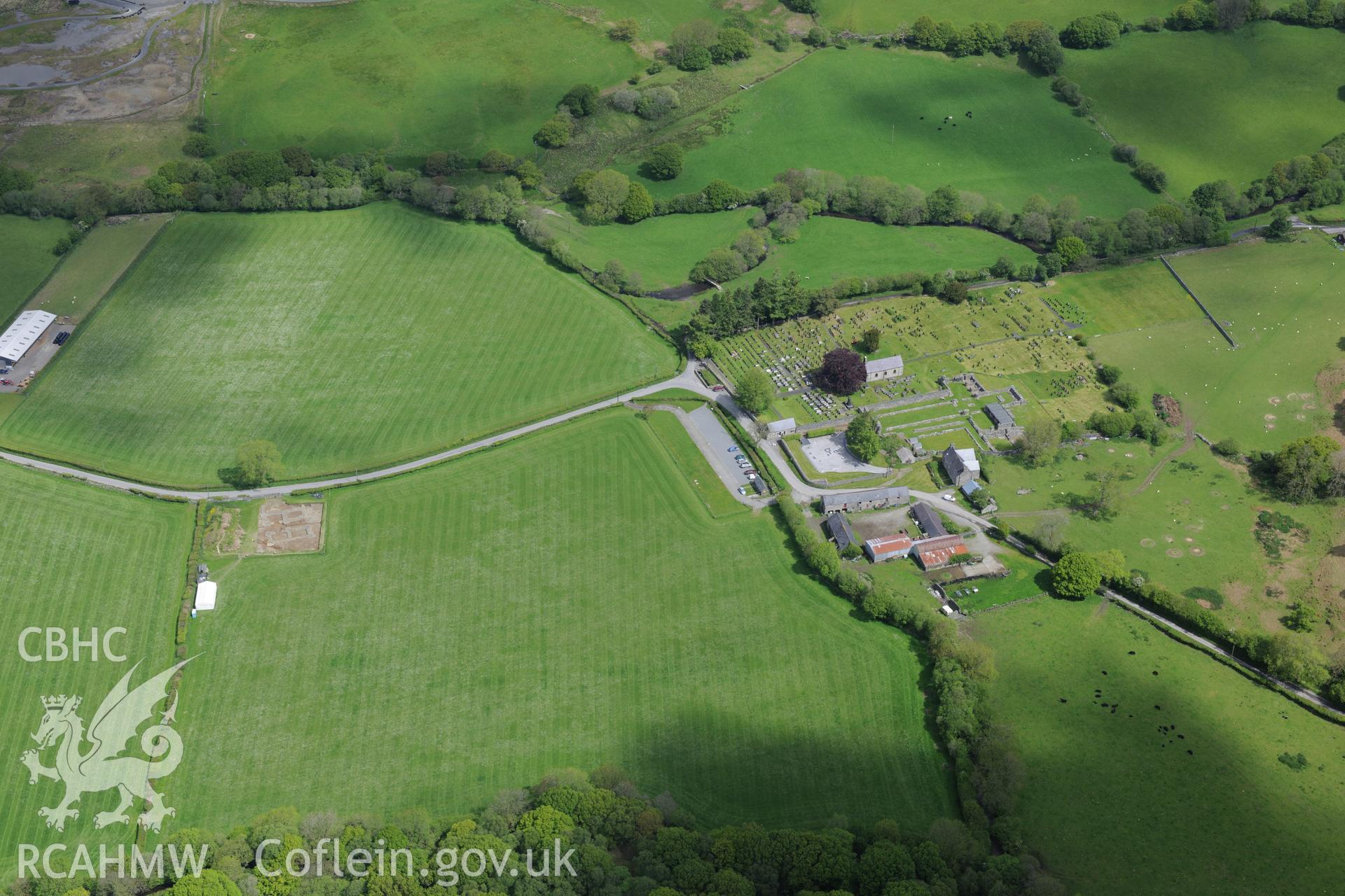 Strata Florida Abbey, Farmhouse, Gatehouse and St. Mary's Church. Oblique aerial photograph taken during the Royal Commission's programme of archaeological aerial reconnaissance by Toby Driver on 3rd June 2015.