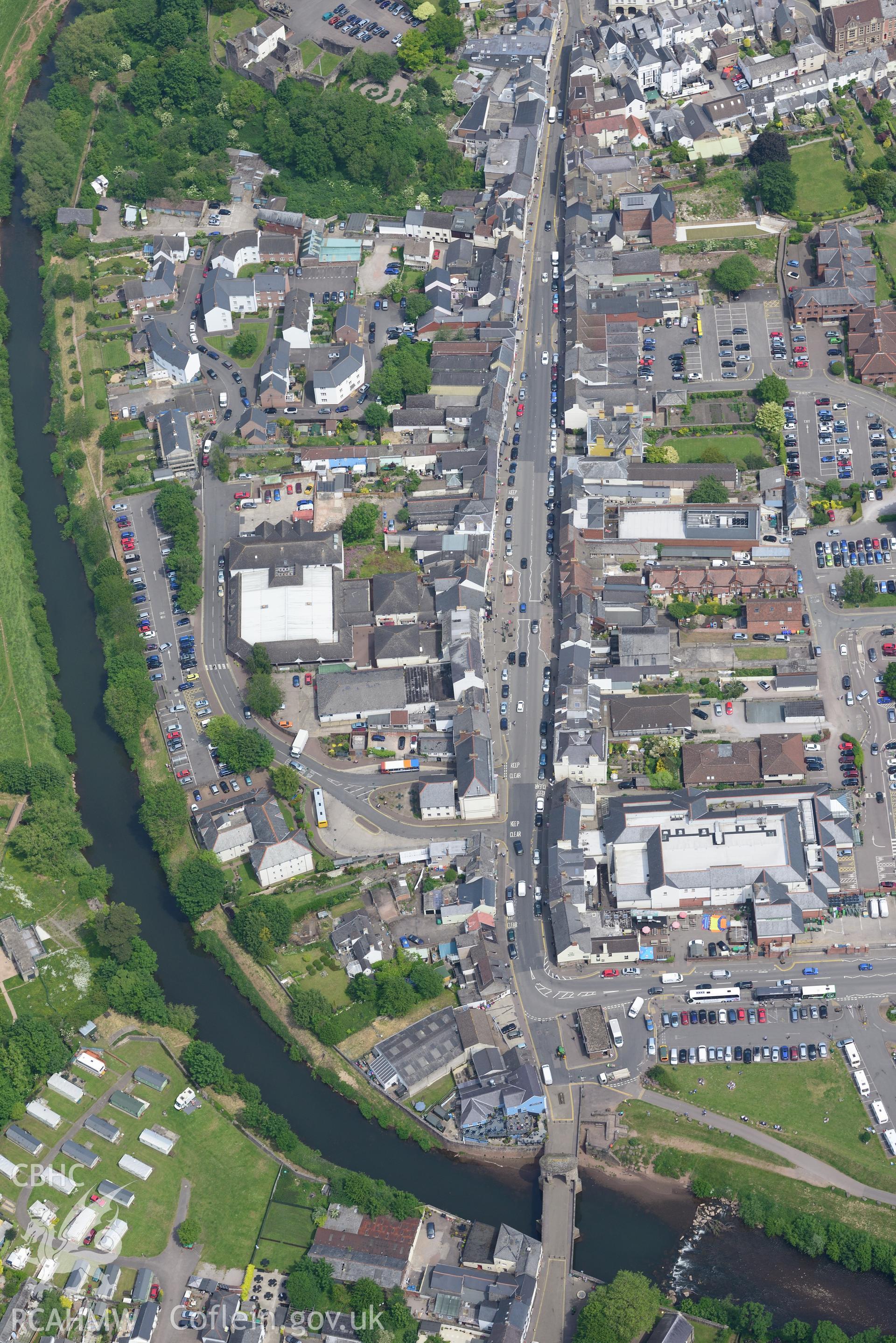 Monmouth Bridge and Western Gate and Monmouth town. Oblique aerial photograph taken during the Royal Commission's programme of archaeological aerial reconnaissance by Toby Driver on 11th June 2015.