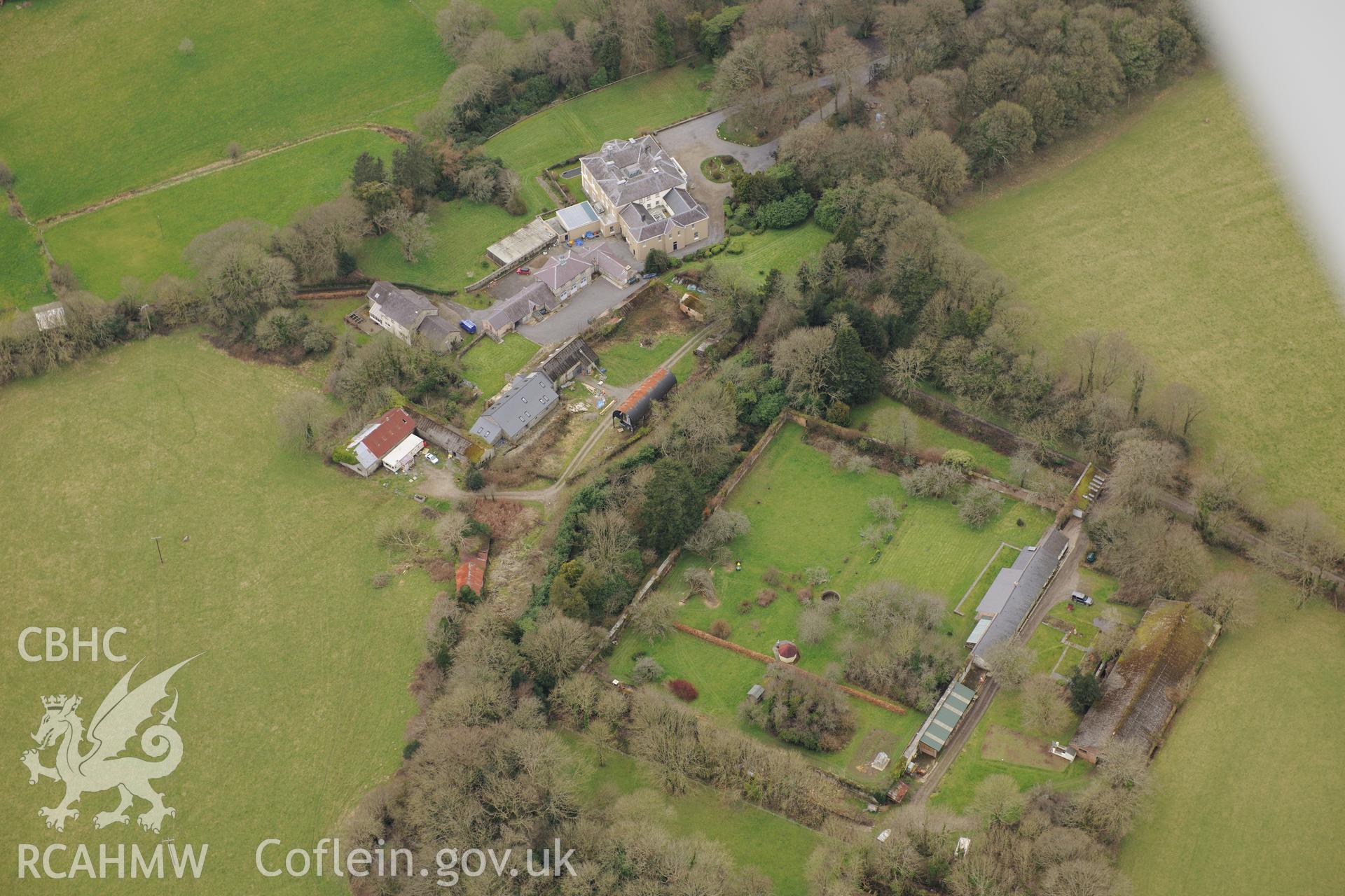 Pen-y-Lan Hall mansion; garden and outbuildings, Llandygwydd, Cardigan. Oblique aerial photograph taken during the Royal Commission's programme of archaeological aerial reconnaissance by Toby Driver on 13th March 2015.