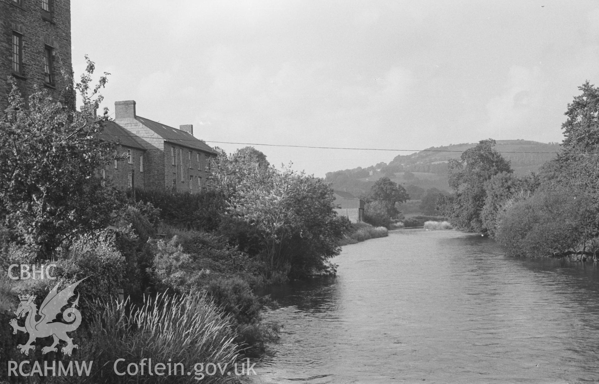 Digital copy of a black and white negative showing view up the river Teifi from the back of the Porth Hotel, Llandysul. Pencoed-y-Foel on skyline on right. Photographed by Arthur O. Chater in August 1965 from Grid Reference SN 4190 4076, looking north.