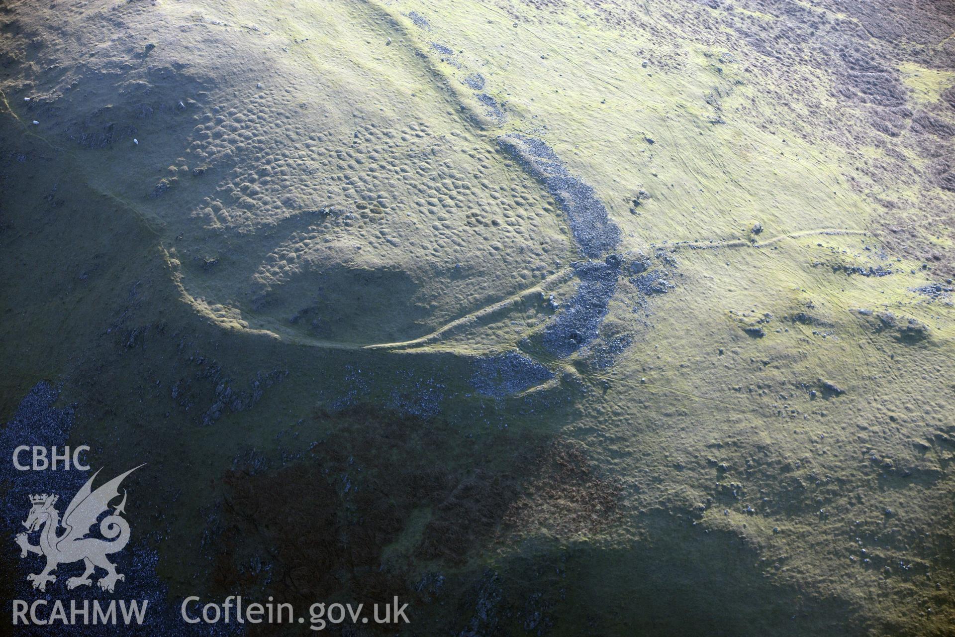 RCAHMW colour oblique photograph of Castle Bank Hillfort. Taken by Toby Driver on 11/03/2010.