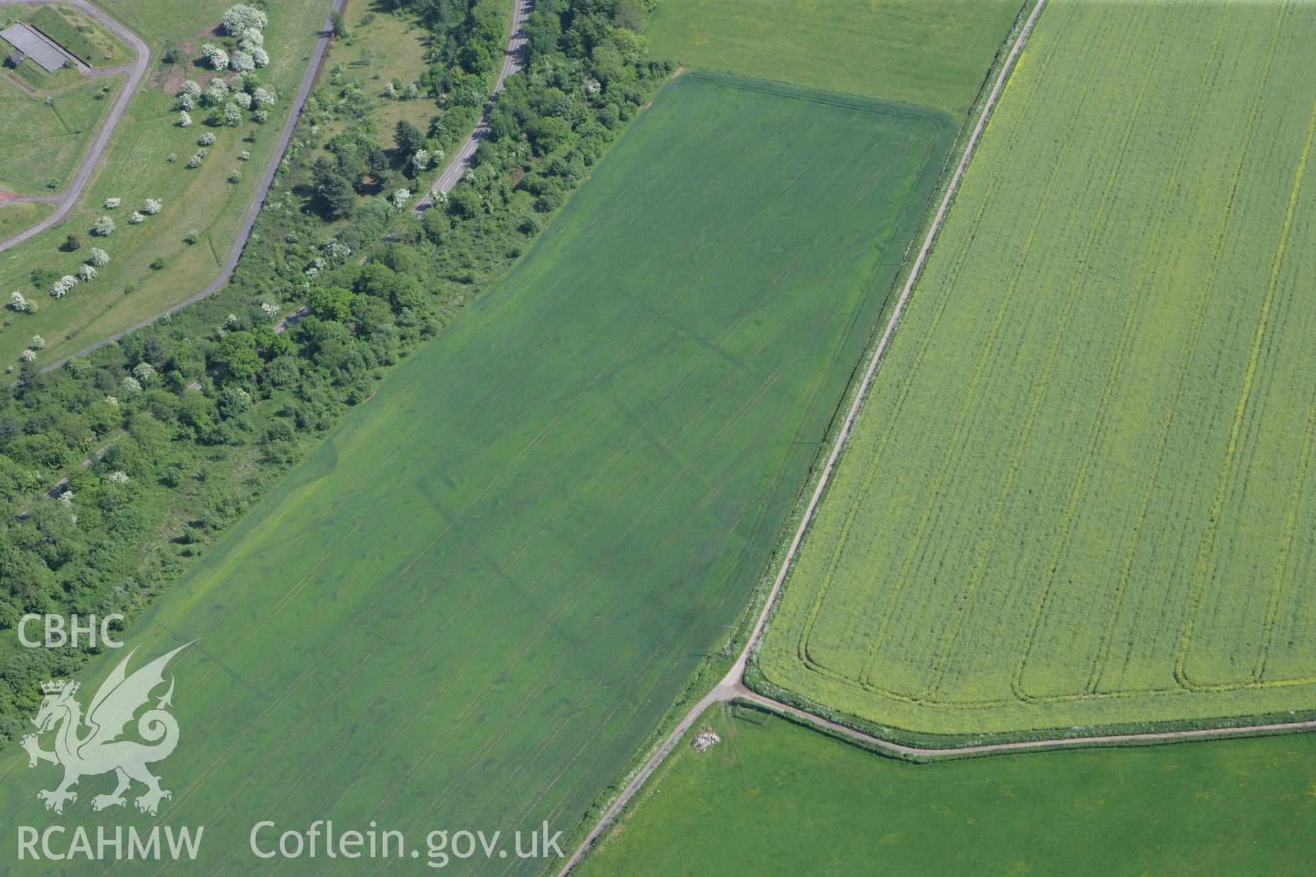 RCAHMW colour oblique photograph of Trewen Enclosure complex (ancient field system). Taken by Toby Driver on 24/05/2010.