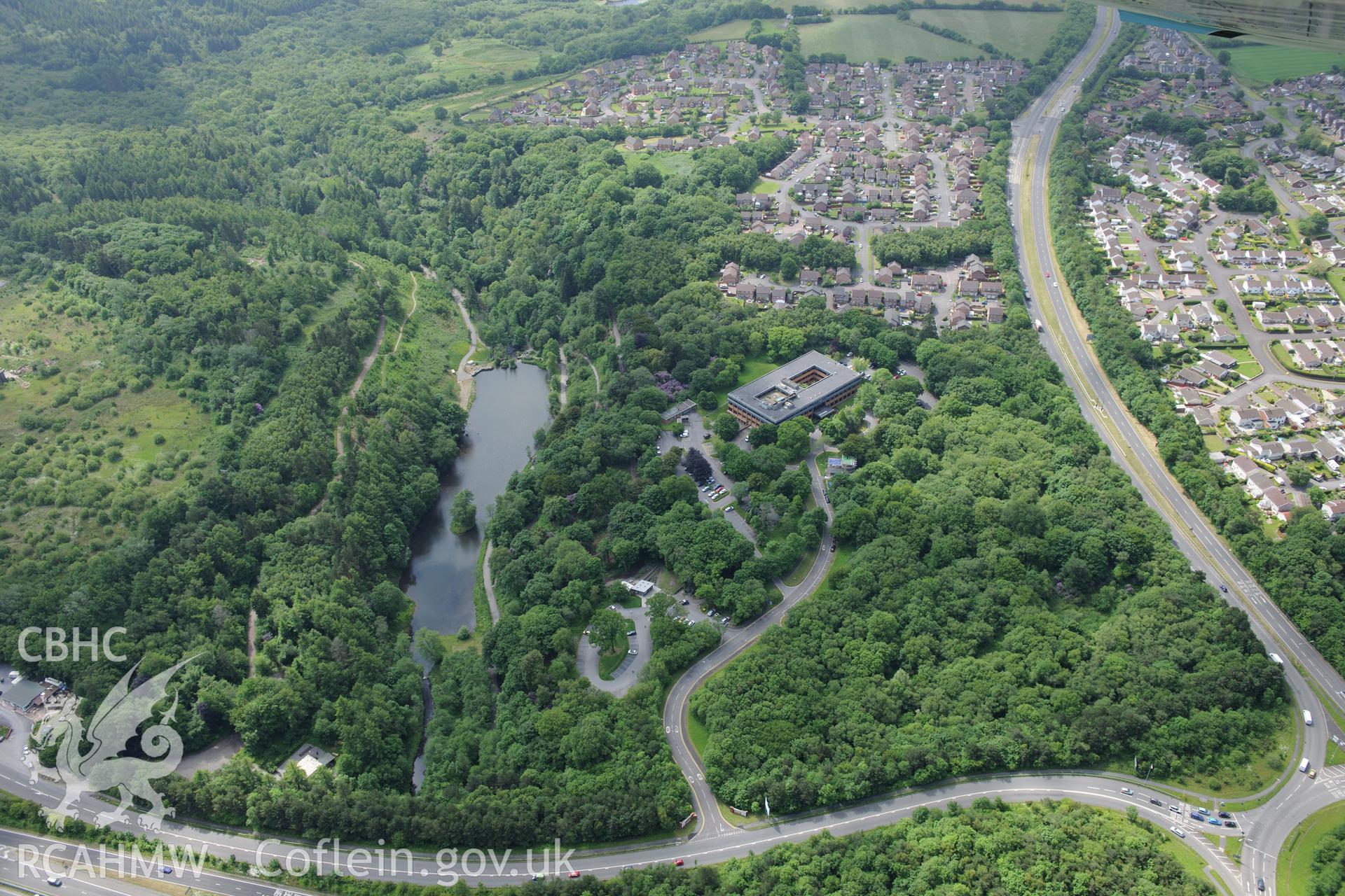 Lliw Valley (or Penllergaer) Civic centre at Penllergaer Park, and the village of Penllergaer. Oblique aerial photograph taken during the Royal Commission's programme of archaeological aerial reconnaissance by Toby Driver on 19th June 2015.