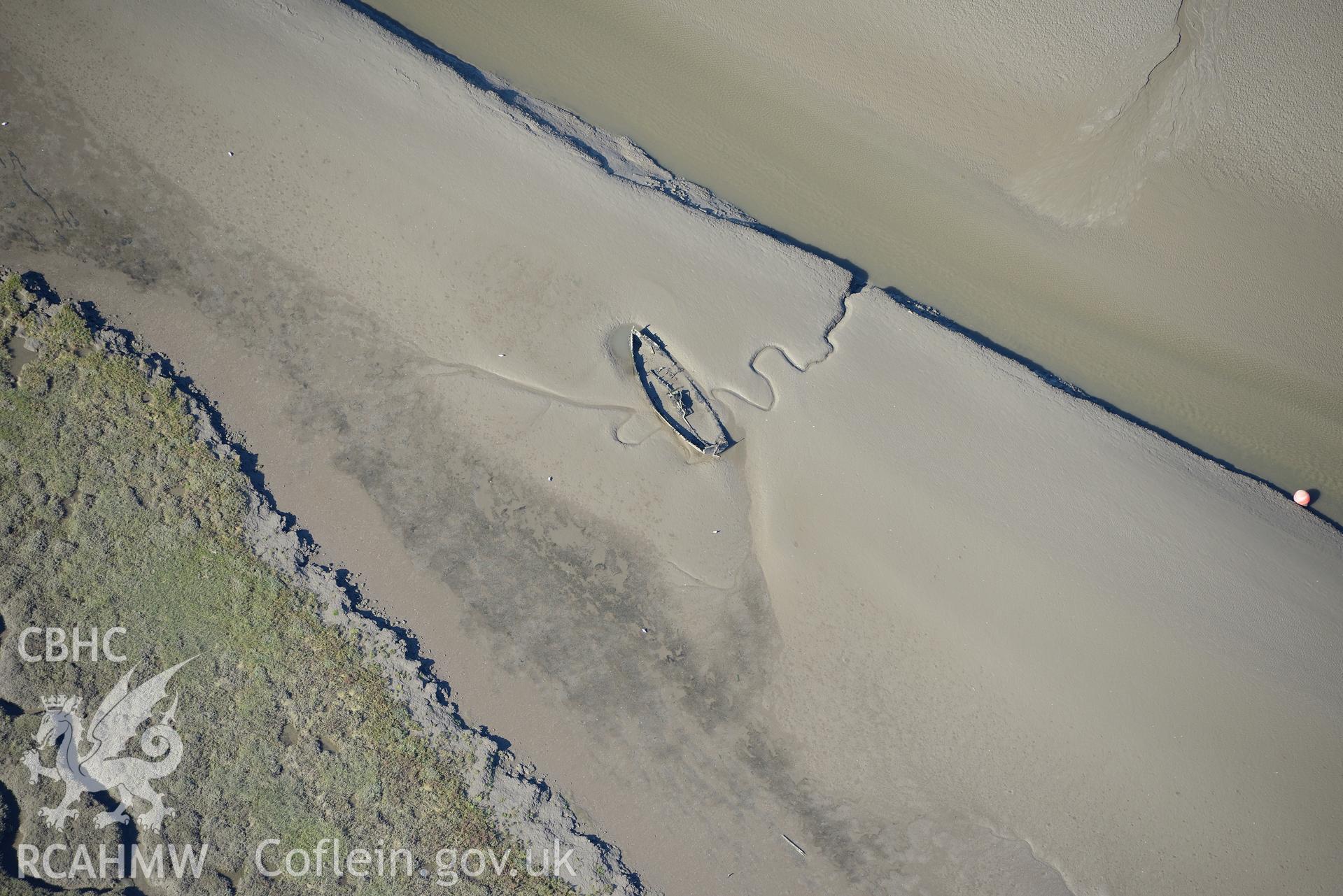 Hull or wreck off the northern coast of the Gower Peninsula, near Penclawdd. Oblique aerial photograph taken during the Royal Commission's programme of archaeological aerial reconnaissance by Toby Driver on 30th September 2015.
