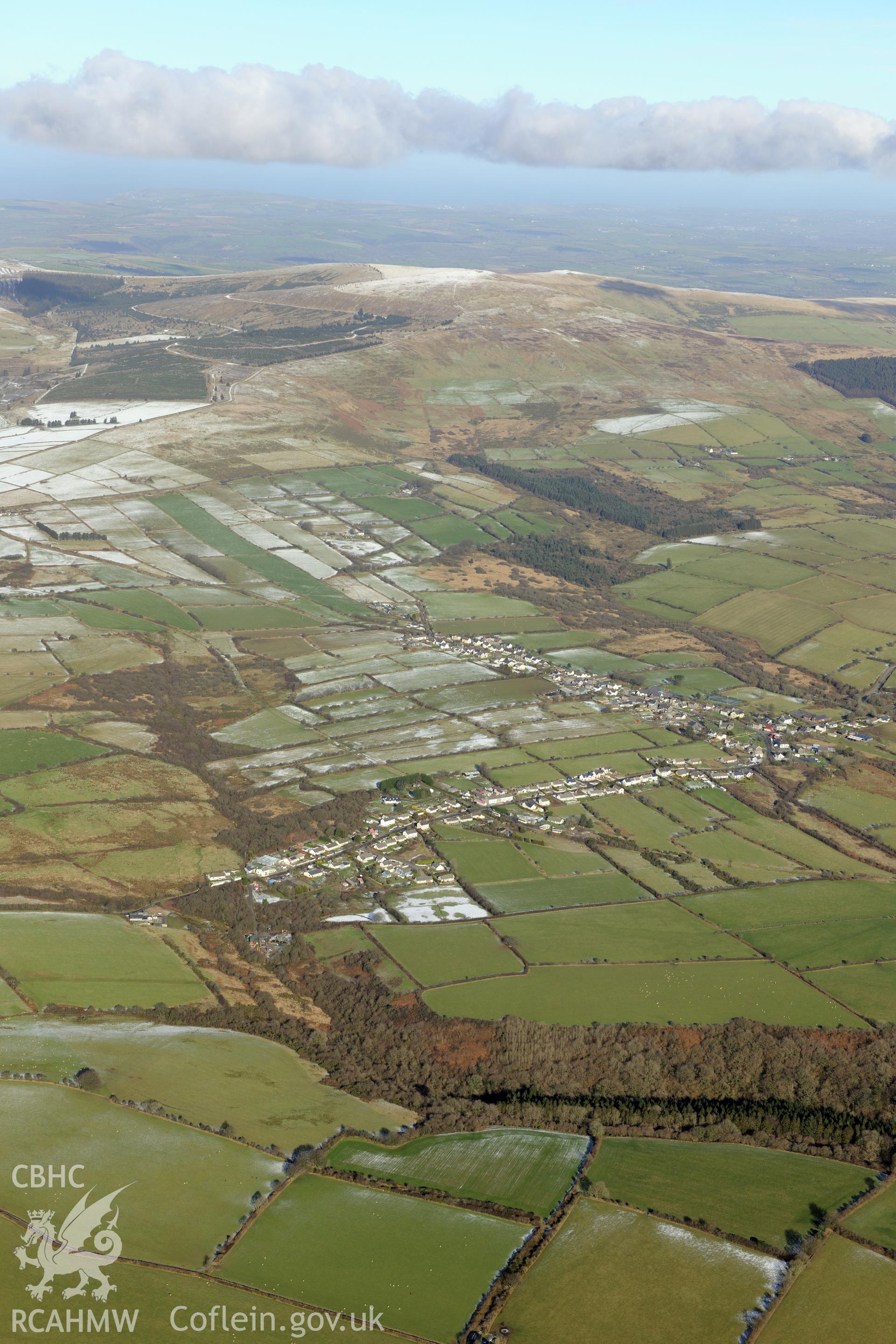View of the village of Maenclochog from the south. Oblique aerial photograph taken during the Royal Commission's programme of archaeological aerial reconnaissance by Toby Driver on 4th February 2015.