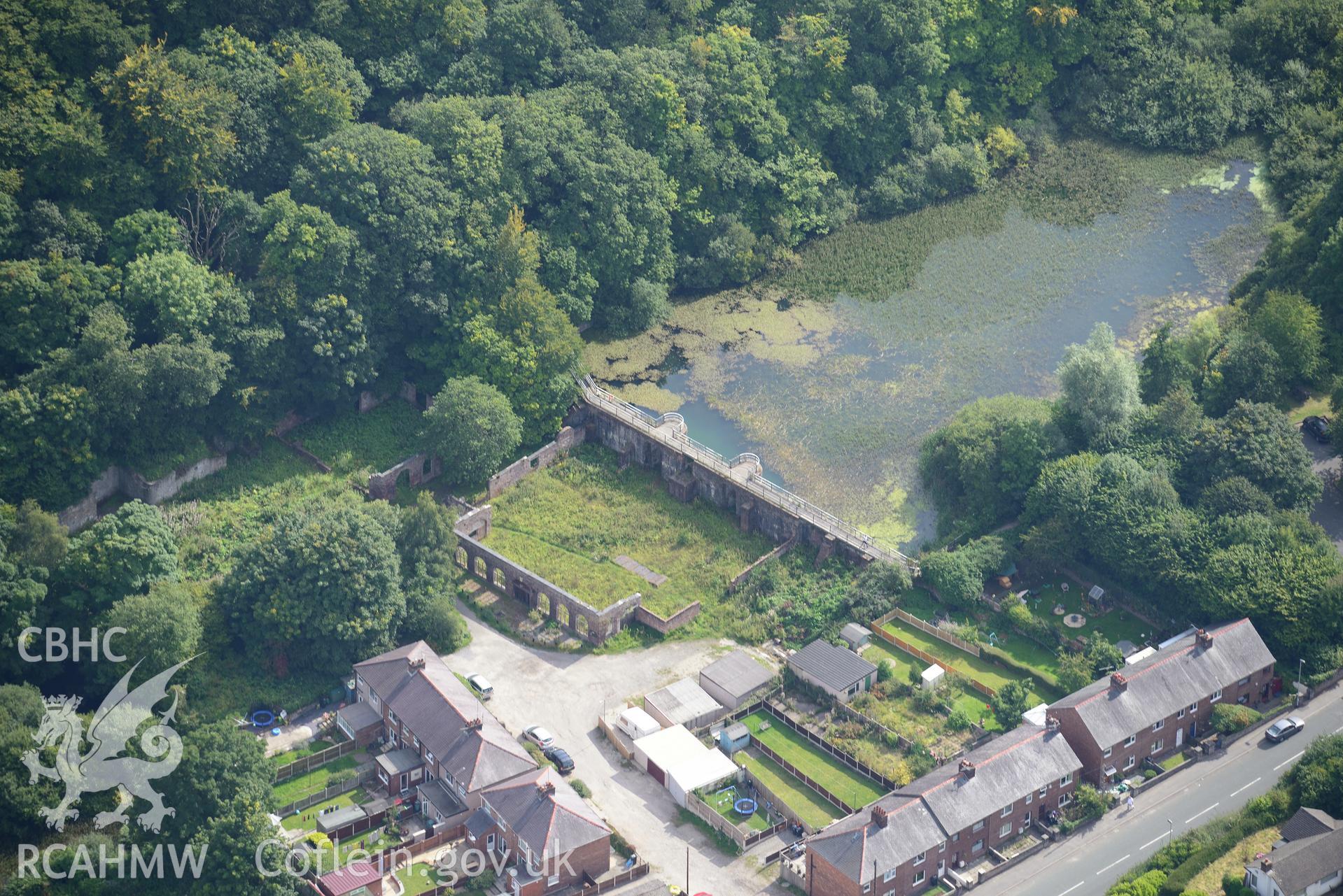 Meadow Mills, Greenfield Valley Heritage Park, Holywell. Oblique aerial photograph taken during the Royal Commission's programme of archaeological aerial reconnaissance by Toby Driver on 11th September 2015.