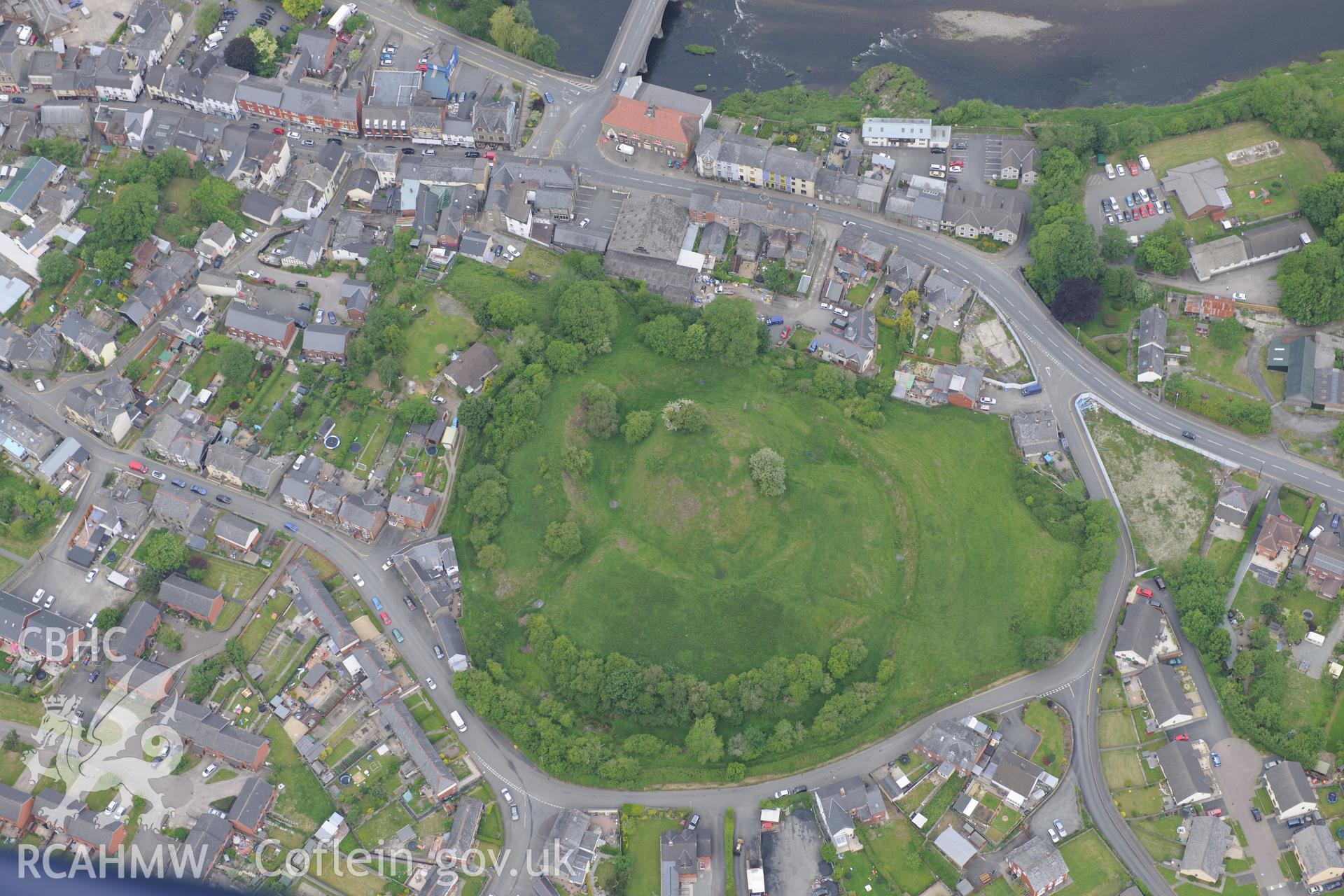 Builth Wells including views of Builth Castle and Builth Wells Market Hall. Oblique aerial photograph taken during the Royal Commission's programme of archaeological aerial reconnaissance by Toby Driver on 11th June 2015.