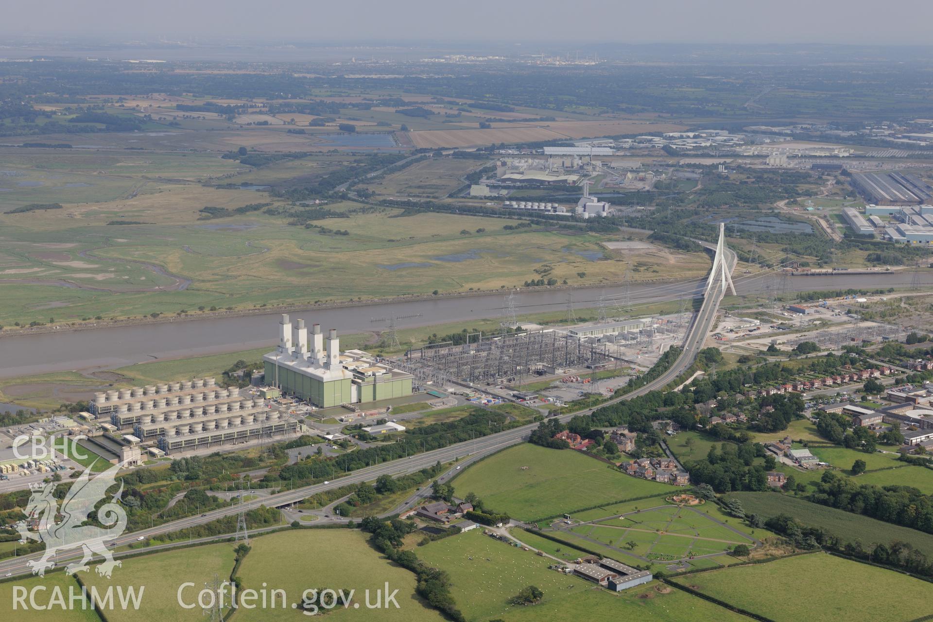 Connah's Quay, including the power station and road bridge. Oblique aerial photograph taken during the Royal Commission's programme of archaeological aerial reconnaissance by Toby Driver on 11th September 2015.