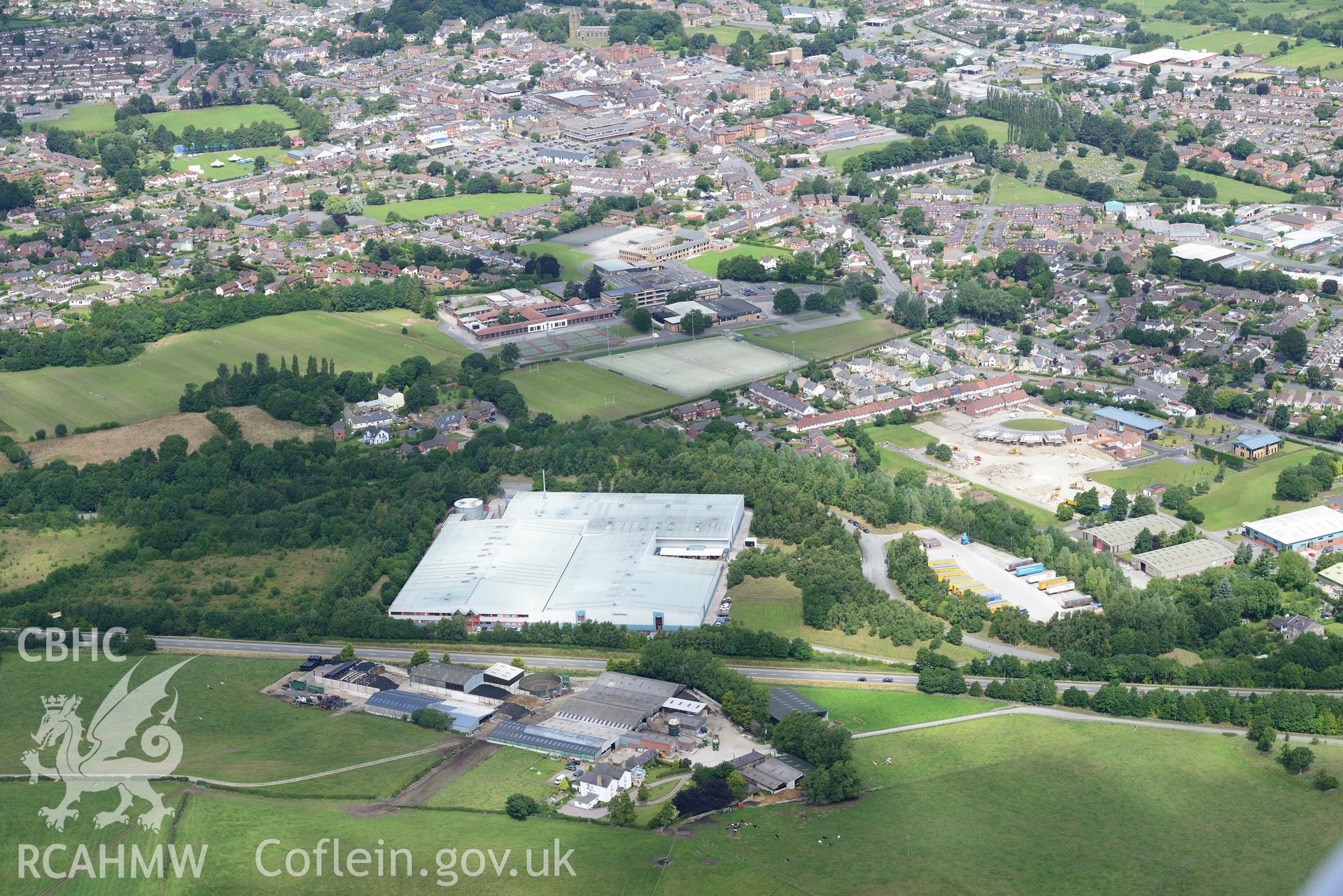 Alun Secondary School and Trebeirdd, Mold. Oblique aerial photograph taken during the Royal Commission's programme of archaeological aerial reconnaissance by Toby Driver on 30th July 2015.