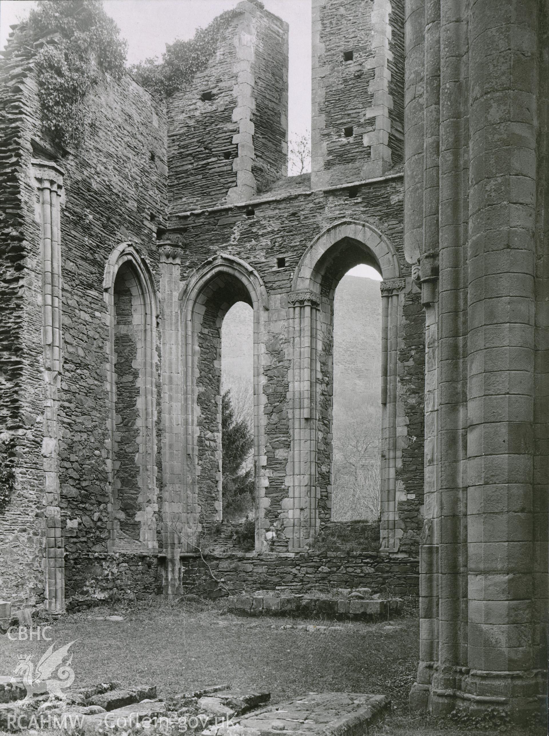Digitised copy of a black and white photograph showing east end of church at Valle Crucis Abbey, taken by F.H. Crossley, 1949. Copied from print as negative held by NMR England (Historic England)