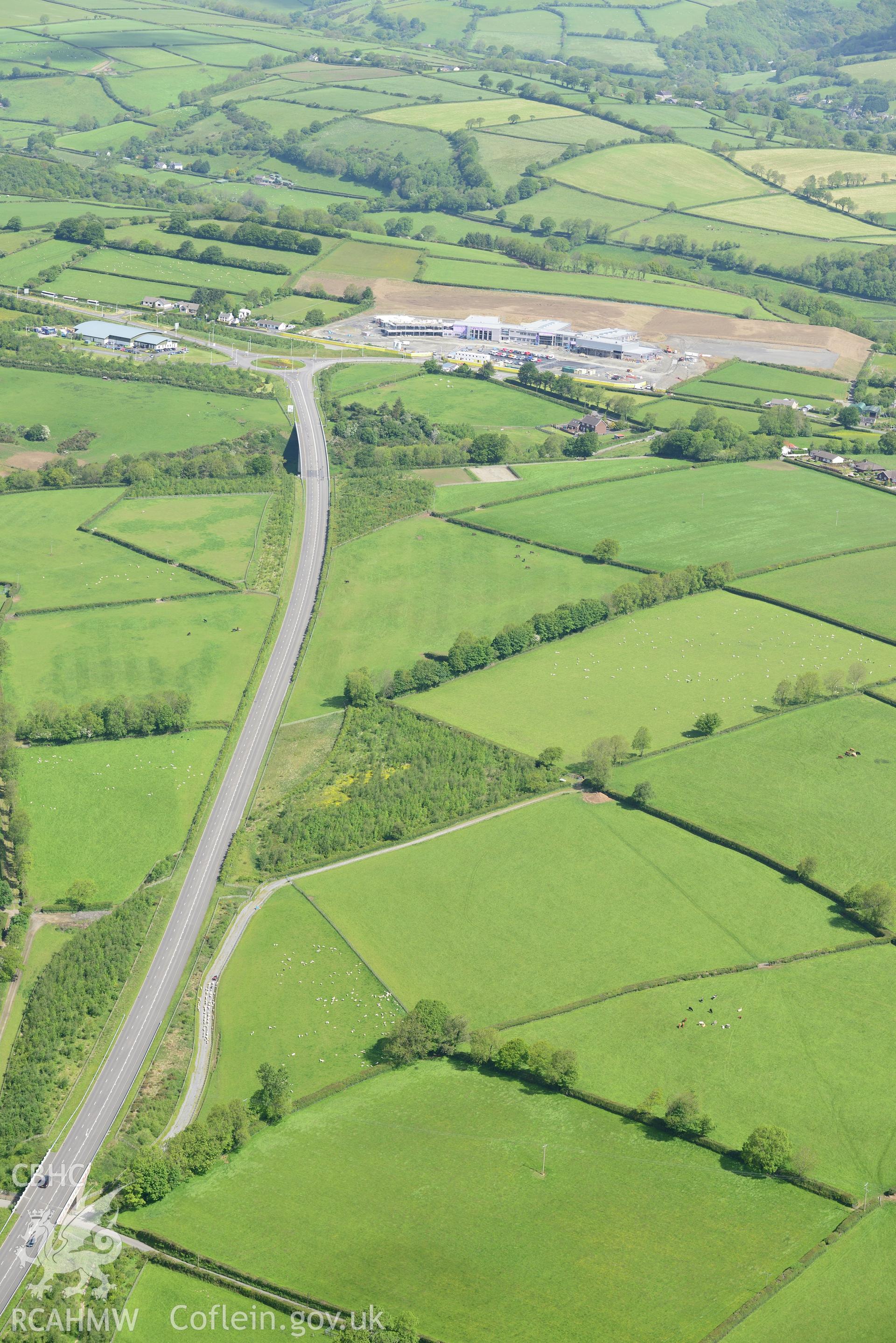 Ysgol Bro Teifi and the Llandysul bypass. Oblique aerial photograph taken during the Royal Commission's programme of archaeological aerial reconnaissance by Toby Driver on 3rd June 2015.