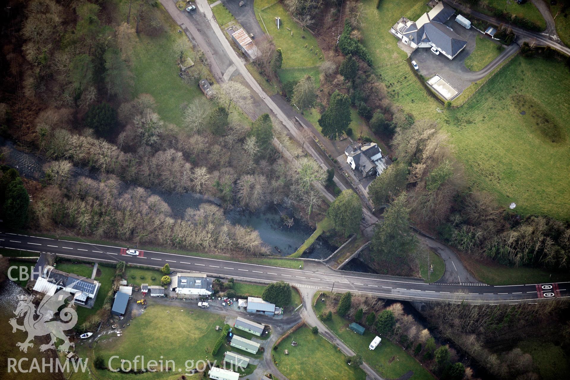 The former Dinas Mawddwy railway station and Pont Minllyn, which crosses the river Dyfi, in the village of Minllyn near Dinas Mawddwy, Dolgellau. Oblique aerial photograph taken during the Royal Commission's programme of archaeological aerial reconnaissance by Toby Driver on 4th February 2015.