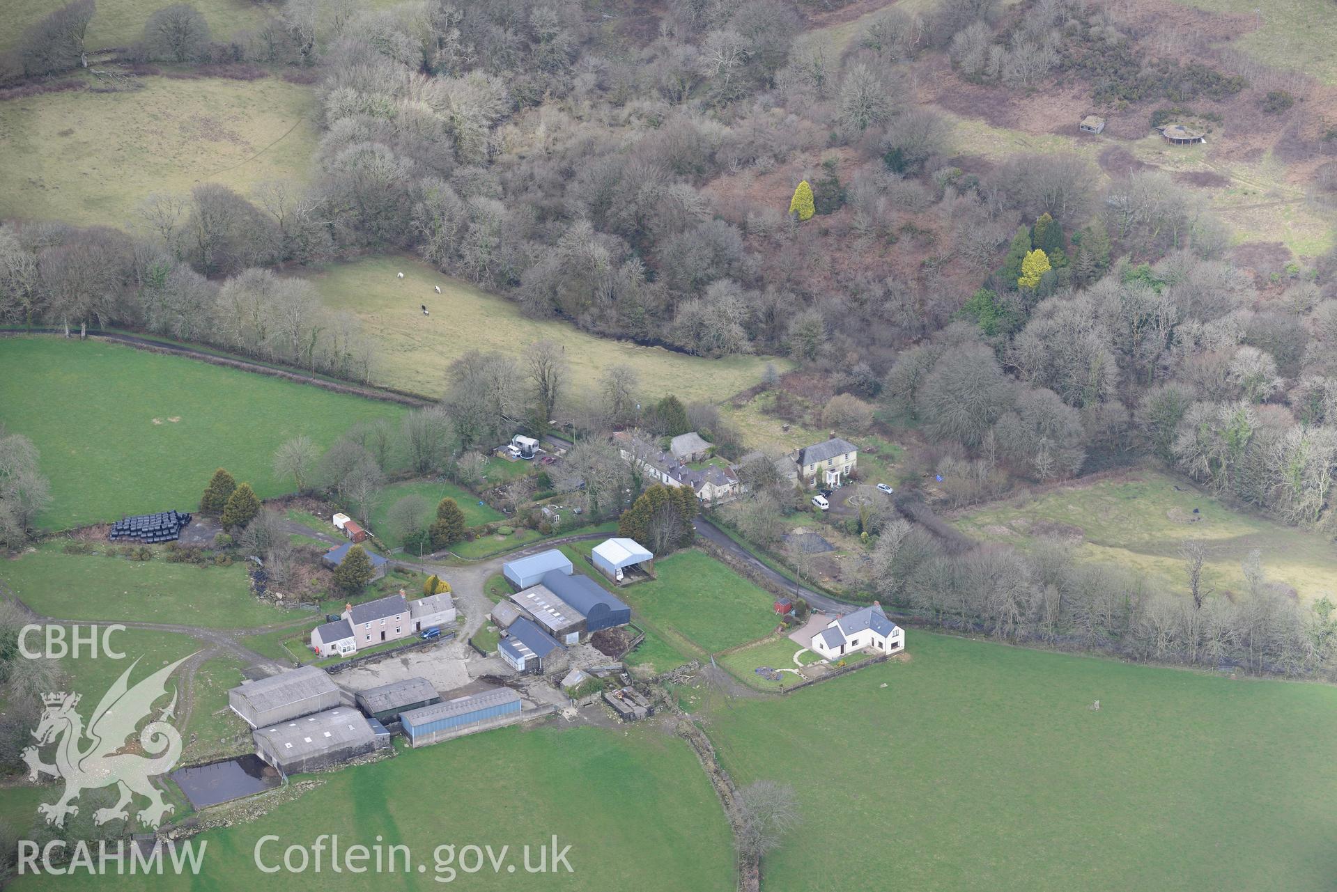 Prysg Farm and two standing stones in its southern fields; Temple Druid house and garden; outbuildings and 1-3 Temple Druid cottages, Maenclochog, Fishguard. Oblique aerial photograph taken during the Royal Commission's programme of archaeological aerial reconnaissance by Toby Driver on 13th March 2015.