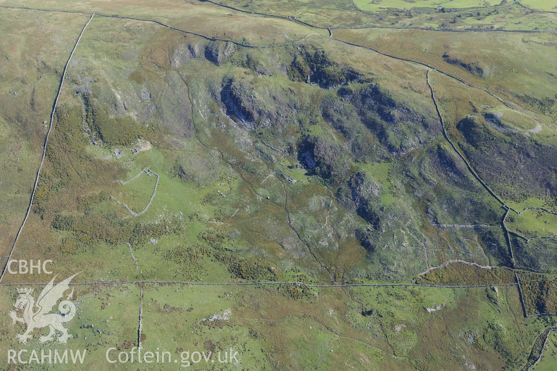 Bryn Castell hillfort and an enclosure or settlement north east of Caerau, near Barmouth. Oblique aerial photograph taken during the Royal Commission's programme of archaeological aerial reconnaissance by Toby Driver on 2nd October 2015.