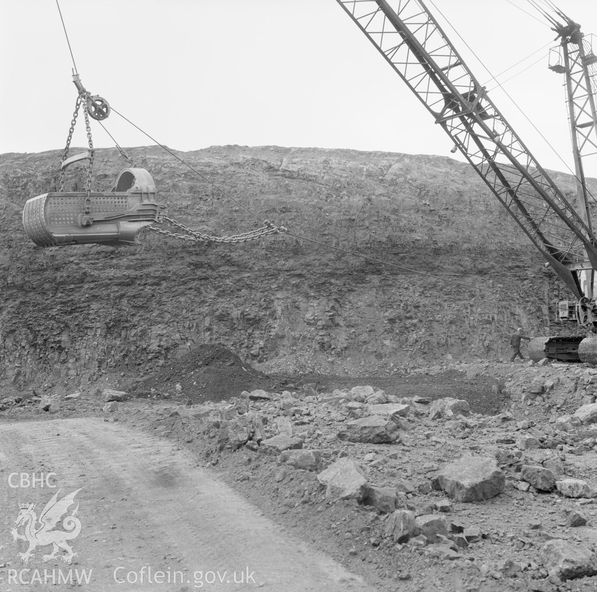 Digital copy of a black and white negative showing working crane at Dowlais Top Opencast Mine, taken by Douglas Hague, undated.