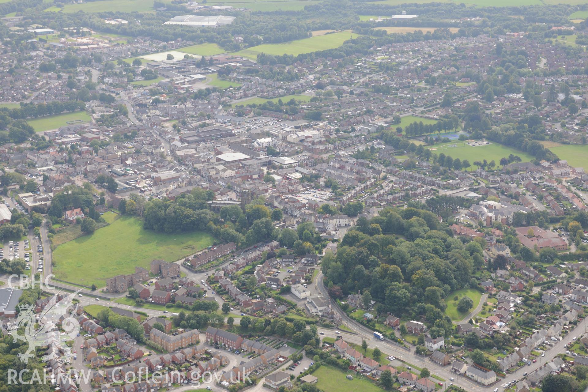 Mold castle and the surrounding town, Mold. Oblique aerial photograph taken during the Royal Commission's programme of archaeological aerial reconnaissance by Toby Driver on 11th September 2015.