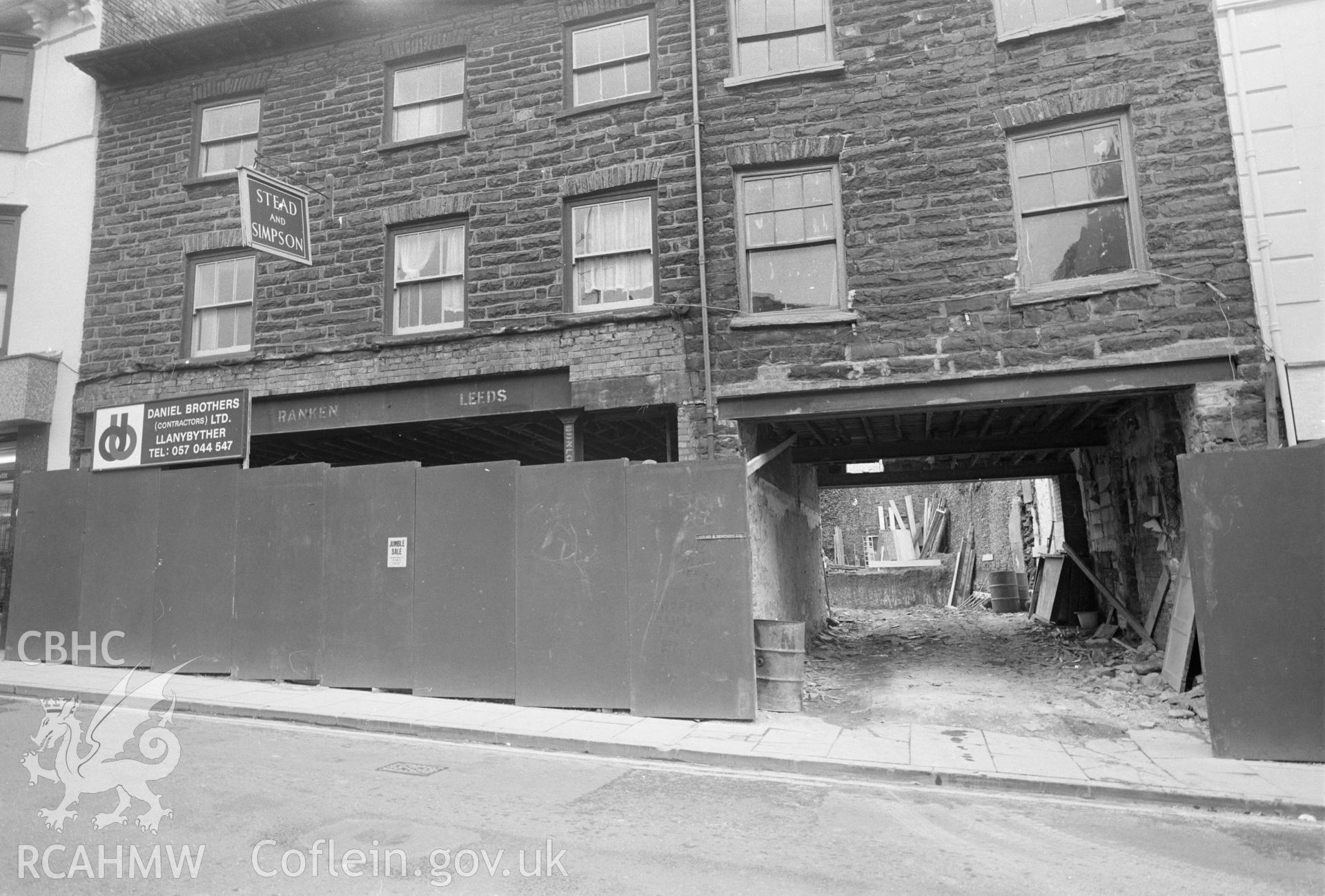Digital copy of a black and white negative showing exterior front view of the old Stead & Simpson Shop, Great Darkgate Street, Aberystwyth.