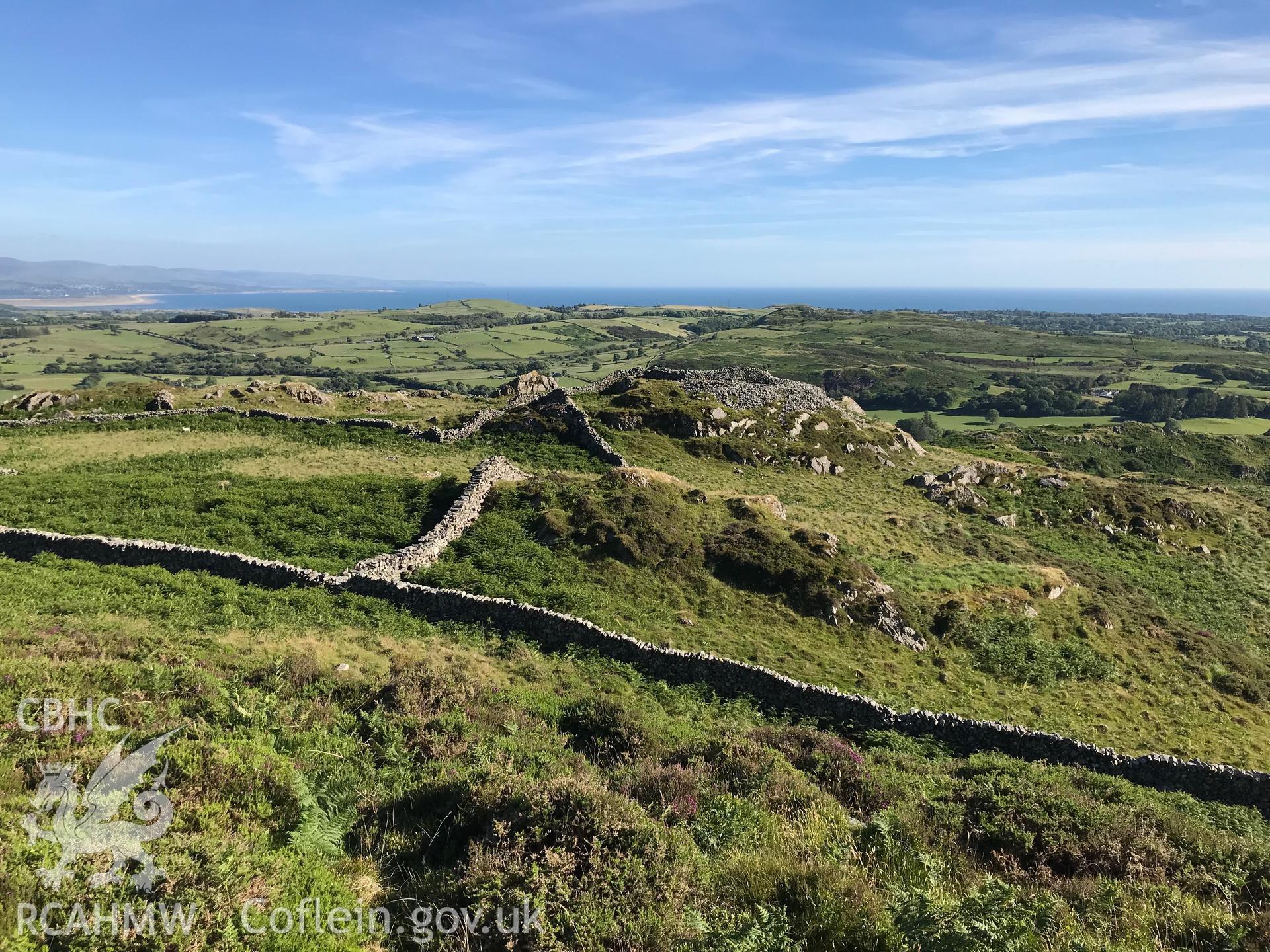 Colour photo showing view of Castell Caerau, Dolbenmaen, in it's setting, taken by Paul R. Davis, 22nd June 2018.