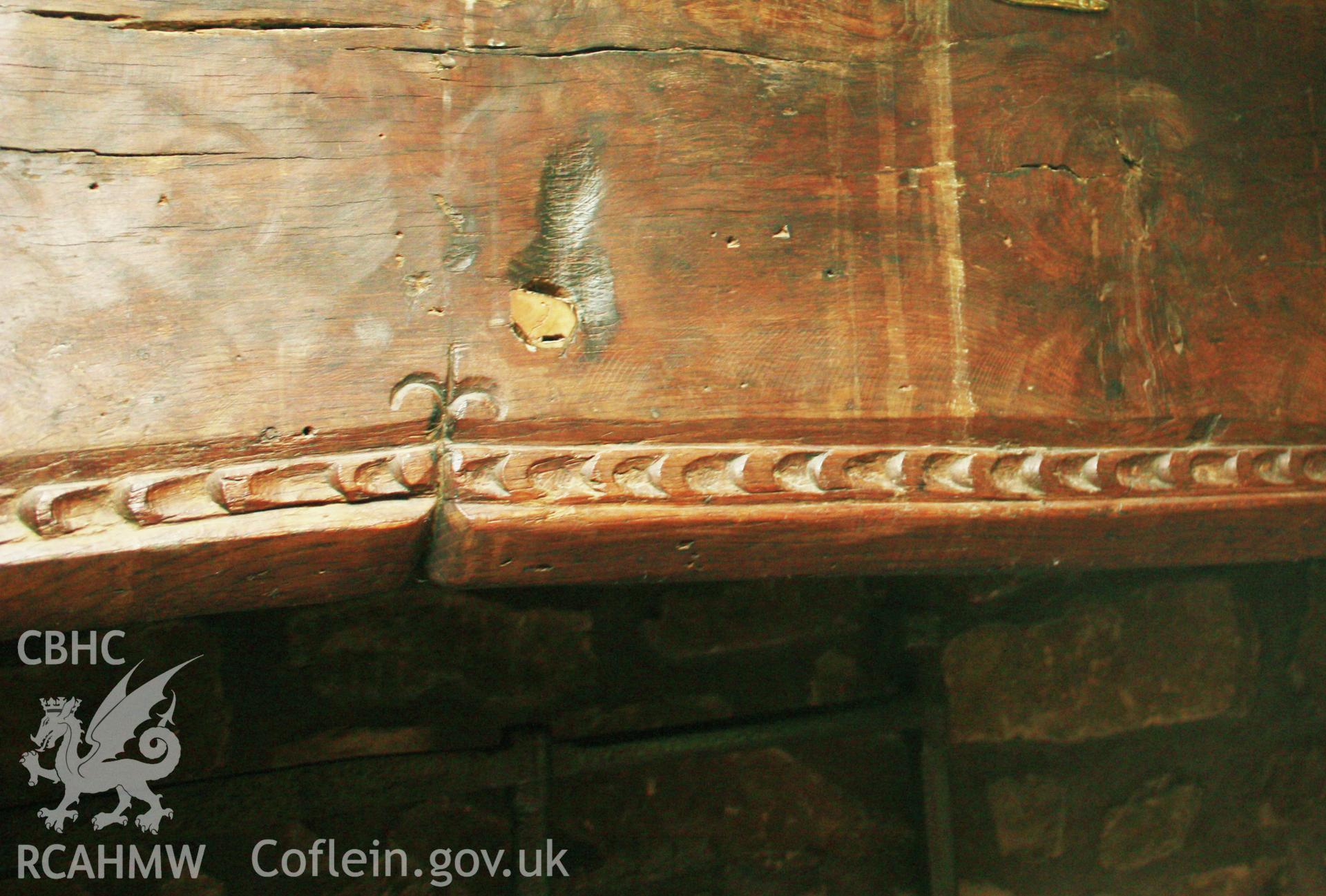 Detail on wooden beam above fireplace at Glanhafon-Fawr Farmhouse. Photographic survey of Glanhafon-Fawr Farmhouse conducted by Geoff Ward on 4th November 2010.