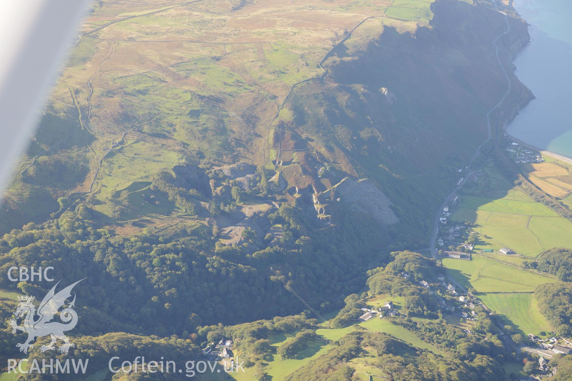 Hen-Ddol slate quarry, south east of Fairbourne. Oblique aerial photograph taken during the Royal Commission's programme of archaeological aerial reconnaissance by Toby Driver on 2nd October 2015.