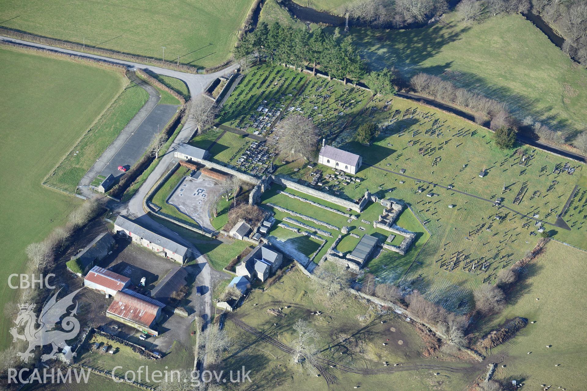 The abbey, abbey farmhouse and St. Mary's Church at Strata Florida, Pontrhydfendigaid. Oblique aerial photograph taken during the Royal Commission's programme of archaeological aerial reconnaissance by Toby Driver on 4th February 2015.