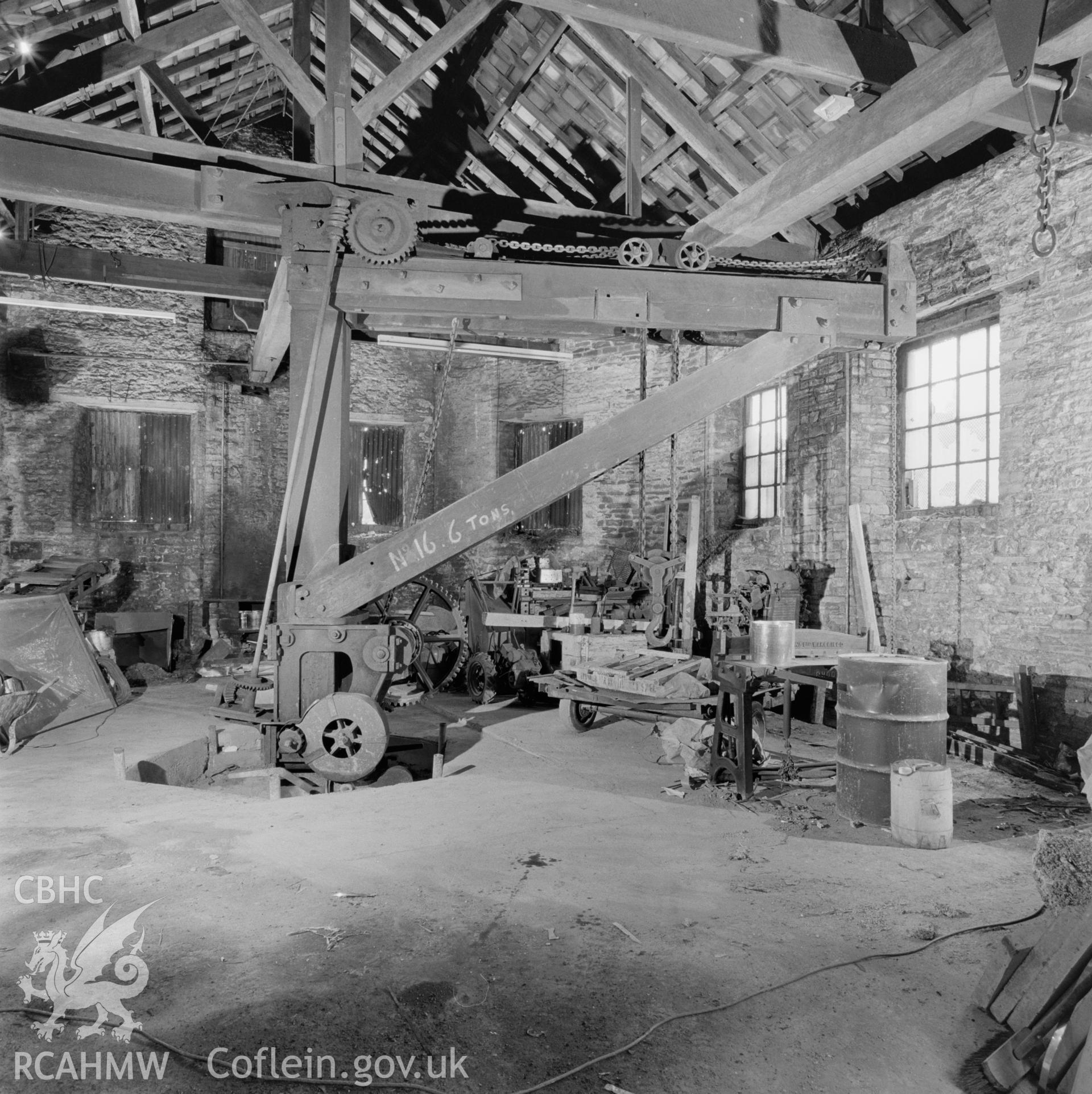 Digital copy of a black and white negative showing the crane at Player's Works Foundry, Clydach, taken by RCAHMW, undated.