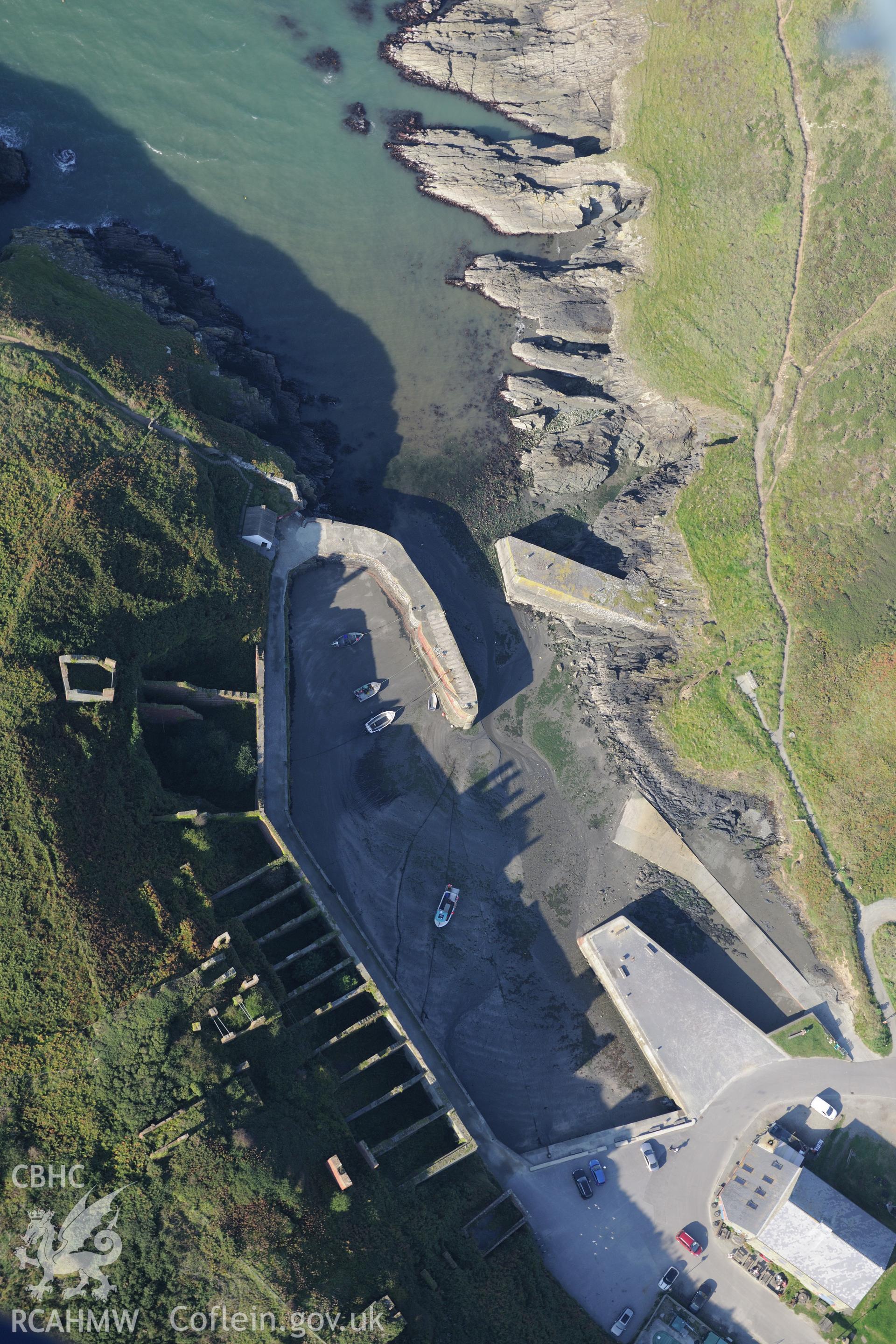 Remains of Porthgain quarry including the harbour and brickworks. Oblique aerial photograph taken during the Royal Commission's programme of archaeological aerial reconnaissance by Toby Driver on 30th September 2015.