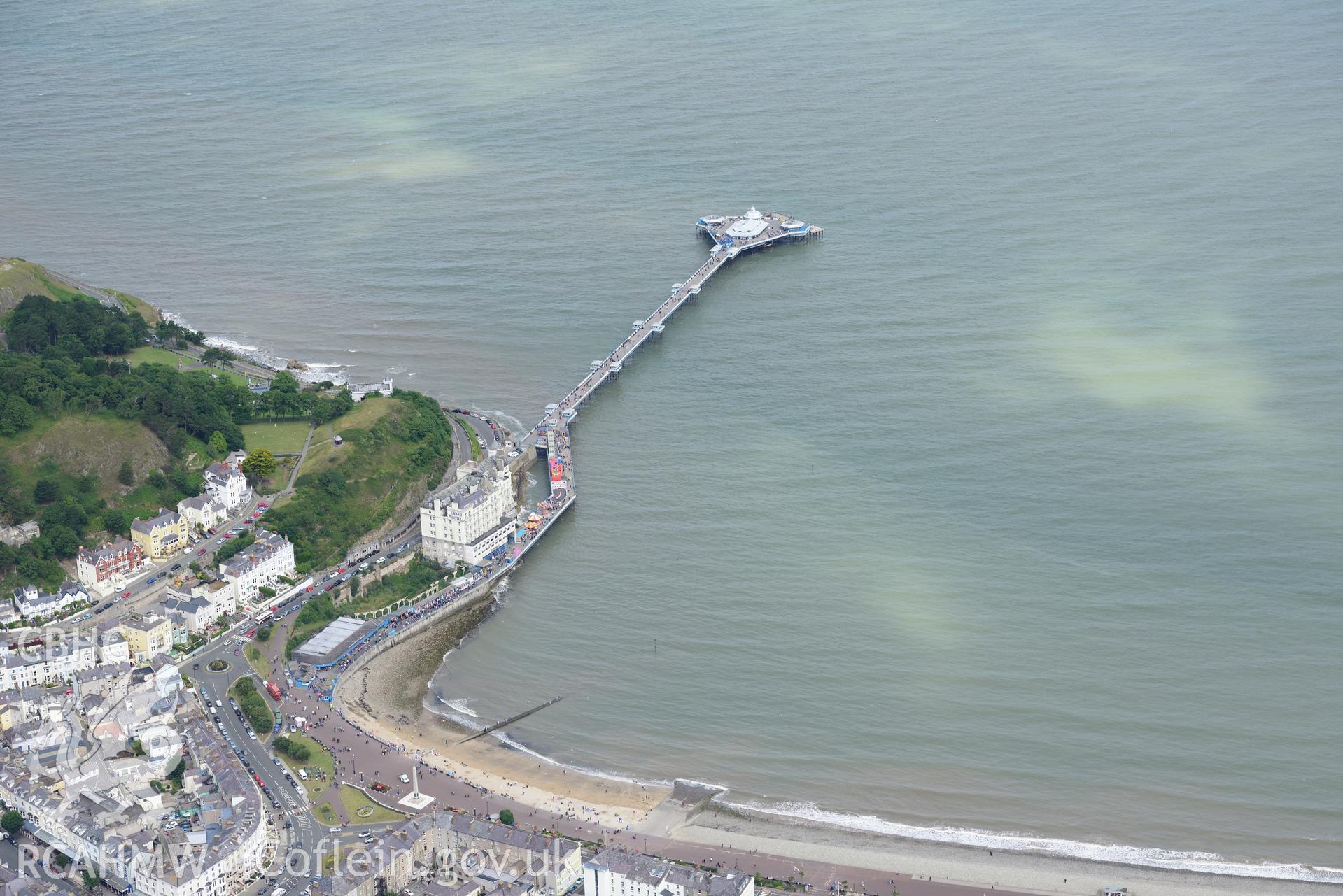 Llandudno pier and bar; cenotaph; Belmont Hotel, Headlands Hotel and Grand Hotel. Oblique aerial photograph taken during the Royal Commission's programme of archaeological aerial reconnaissance by Toby Driver on 30th July 2015.