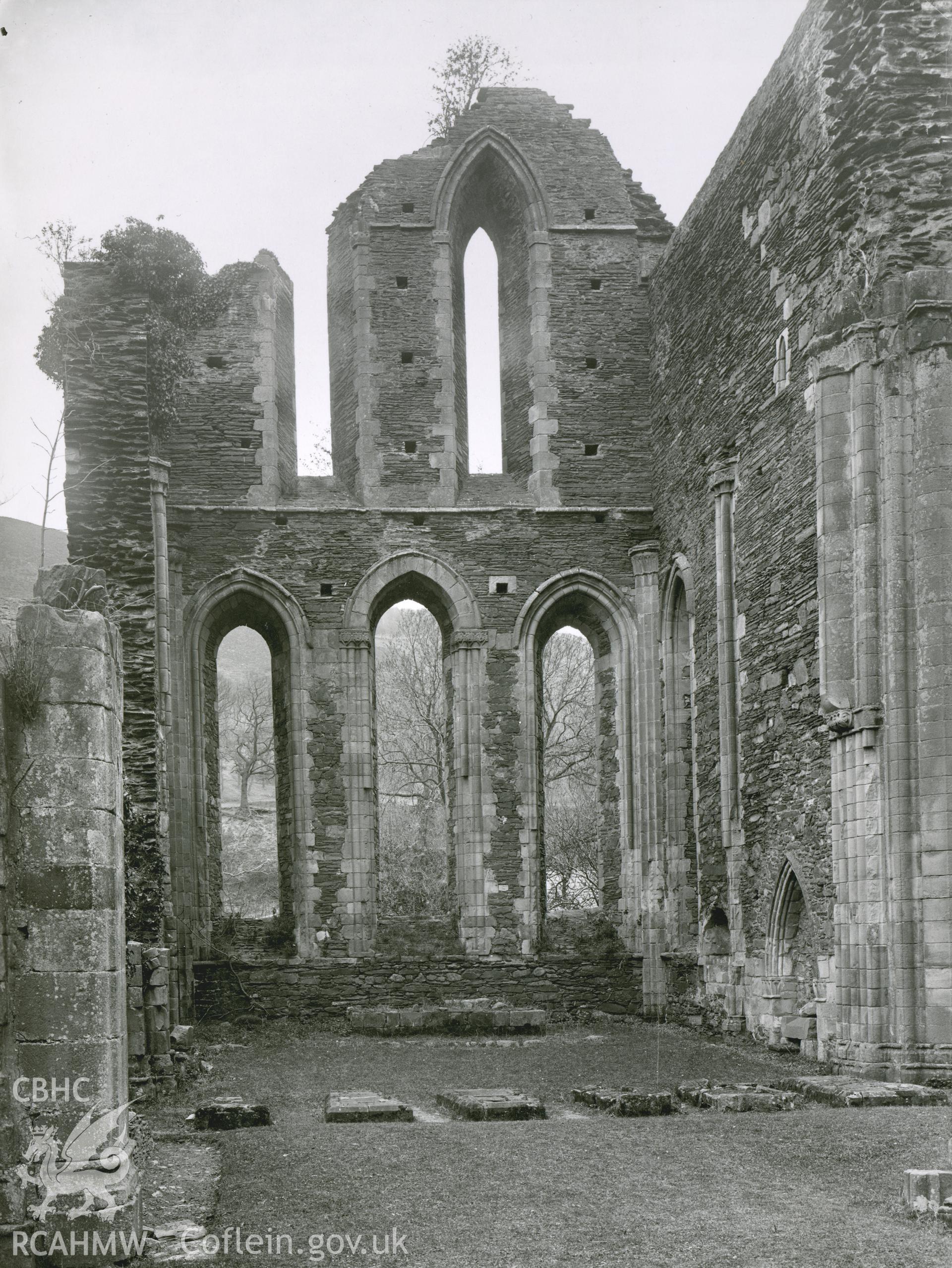 Digitised copy of a black and white photograph showing east end of choir at Valle Crucis Abbey, taken by F.H. Crossley, 1949. Copied from print as negative held by NMR England (Historic England).