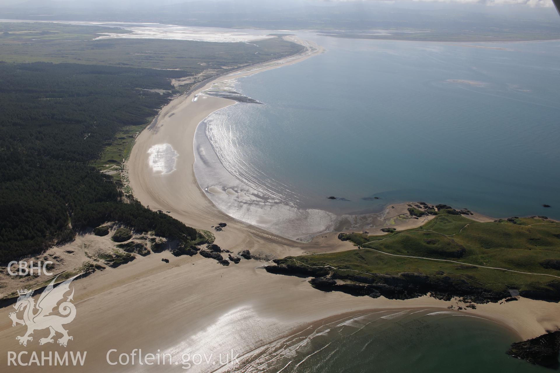 Llanddwyn Island and the fish trap off its coast. Oblique aerial photograph taken during the Royal Commission's programme of archaeological aerial reconnaissance by Toby Driver on 23rd June 2015.